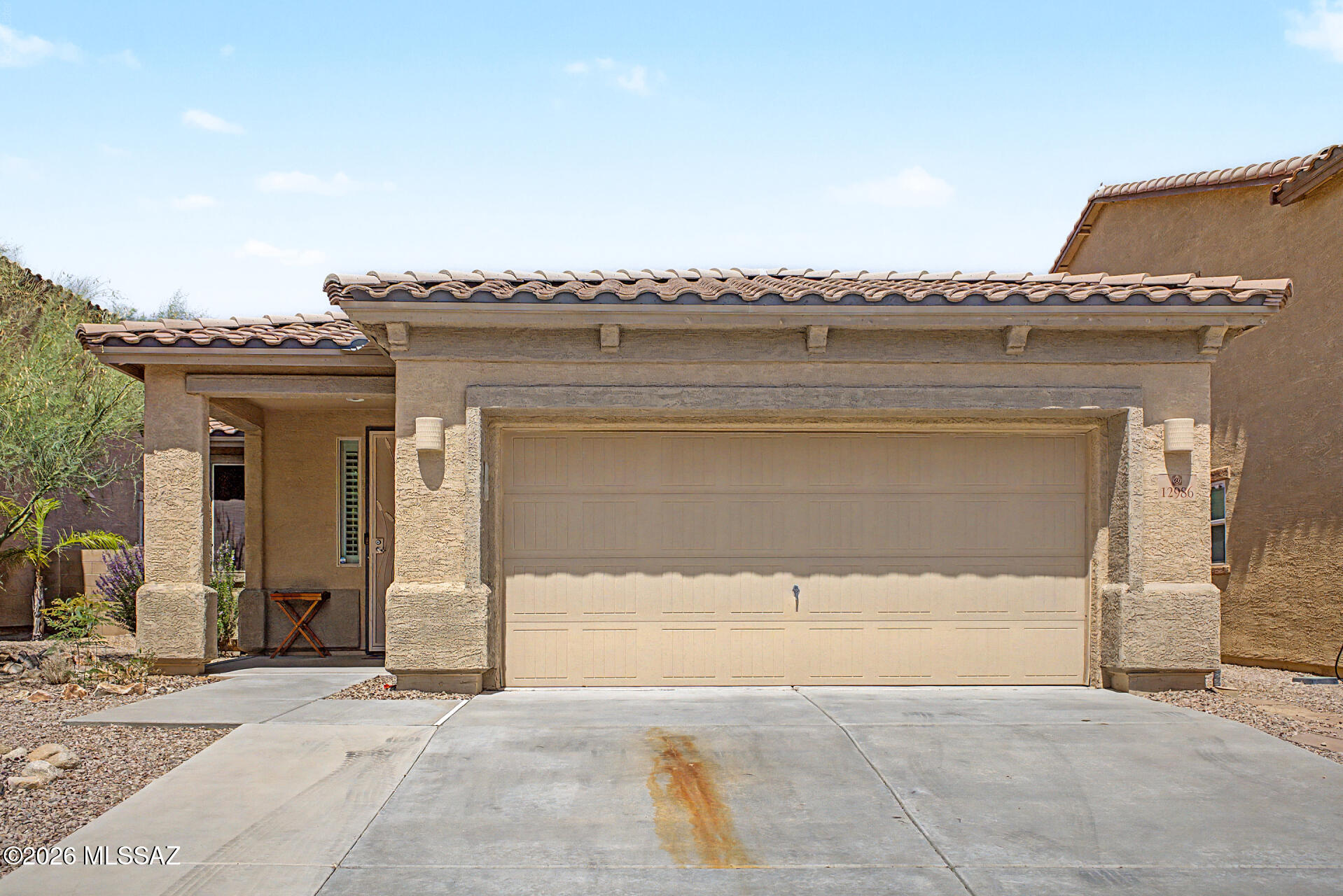 Welcome to this beautifully maintained single story home in Oro Valley! Framed by a tile roof, stacked stone accents, and mature desert landscaping, the curb appeal sets the tone from the moment you arrive. Inside, the open concept great room features a stucco wrapped fireplace, oversized ceiling fan, and plantation shutters throughout. The chef's kitchen boasts cherry cabinetry, granite counters, mosaic tile backsplash, stainless appliances, and an oversized island. The primary suite offers wood look flooring, dual sinks, soaking tub, and a separate shower. Two additional bedrooms share a full guest bath. Out back, enjoy a covered paver patio, artificial turf side yard, and a fully walled, private backyard. Don't miss it!

Note, the seller is giving the option to sell fully furnished.