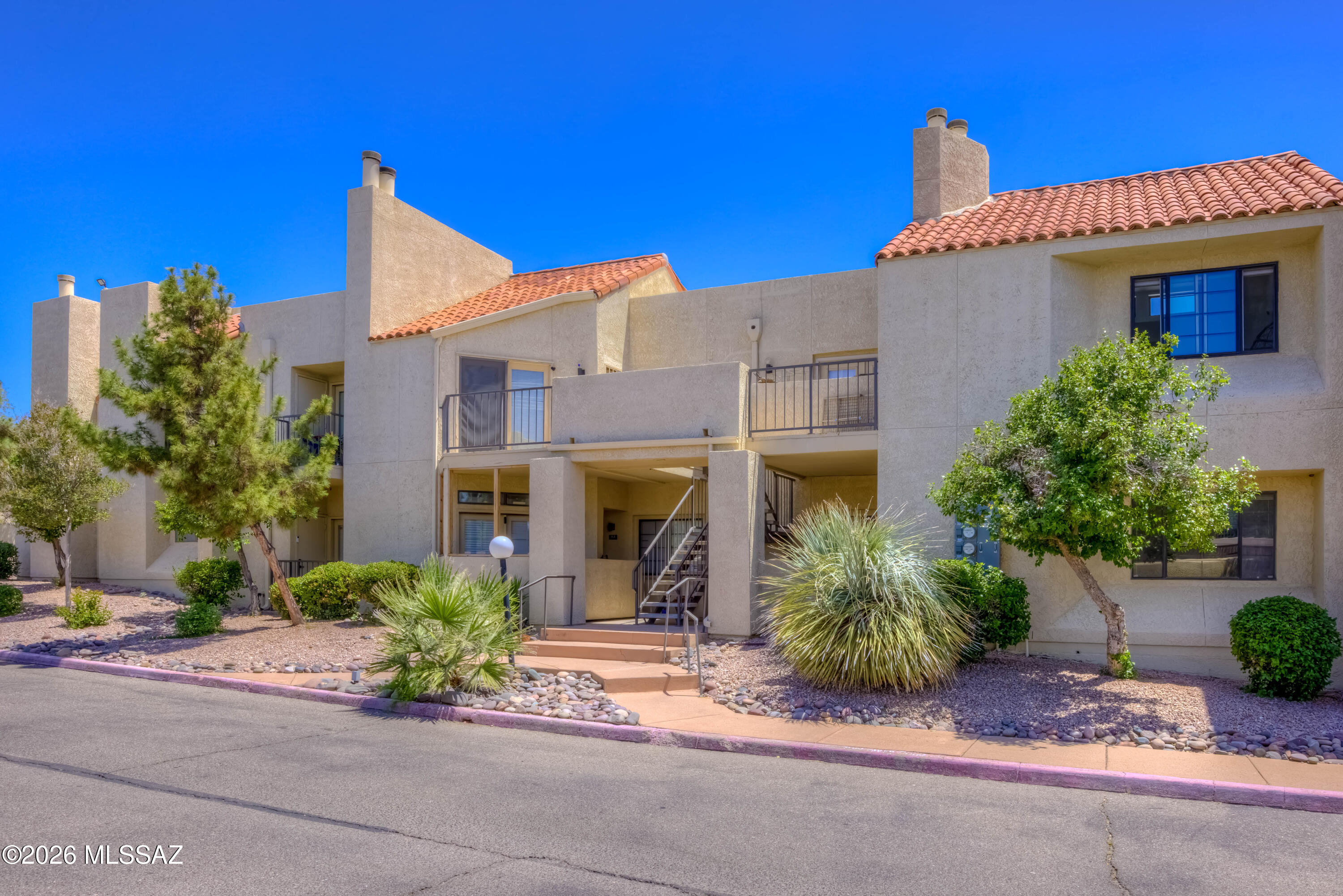 Range Pricing. Seller to consider/accept offers $130,000-$140,000. Enjoy easy, low-maintenance living in this charming ground-floor 1-bedroom, 1-bath condo featuring beautiful mountain and sunset views. This unit offers ceramic tile flooring throughout, wood-burning fireplace, newer walk-in shower, all appliances included, and a private covered patio accessible from the bedroom--perfect for relaxing outdoors. Ideally located near the University of Arizona, River Walk bike path, shopping, and dining, this home combines comfort with convenience. Community amenities include covered parking, rec center, pool, spa, & fitness facilities. The HOA covers water, sewer, trash, exterior maintenance, and roof--making this an excellent opportunity for both homeowners and investors alike.