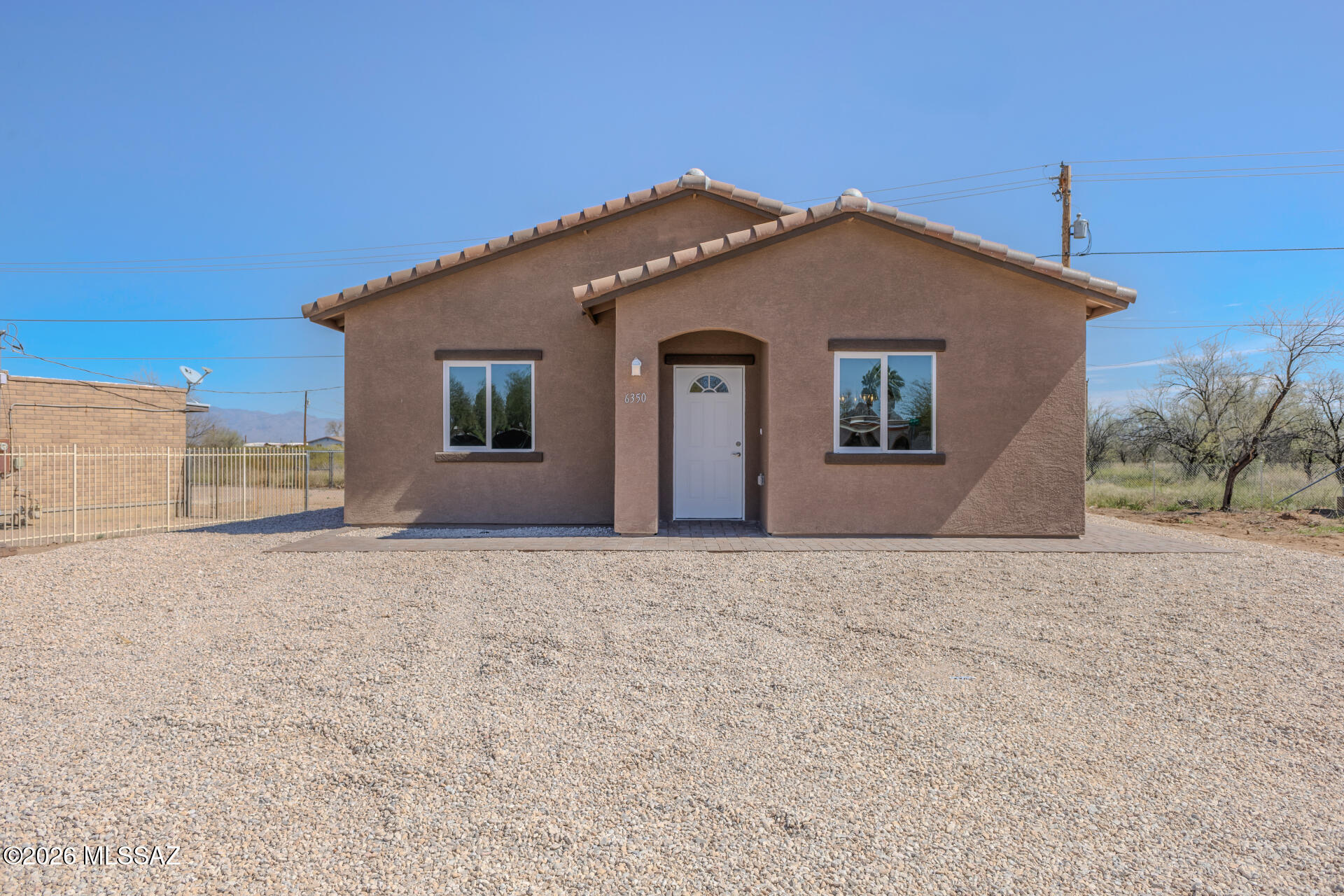 Price range between $289,000- $299,000. Brand New Construction | No HOA | Oversized Lot. Welcome to this stunning brand-new 2026-built home nestled in Tucson's desirable Southwest side! This contemporary 3-bedroom, 2-bath home offers 1,368 sq ft of thoughtfully designed living space. Step inside to discover high ceilings with modern LED lights and elegant tile flooring that flows. The gourmet kitchen is a showstopper, featuring beautiful alder wood cabinets and sleek quartz countertops. The principal bathrooms is just impressive, with stylish floating cabinets and a custom decorative shower that adds a touch of luxury. What truly sets this property apart is the expansive 0.2-acre lot -- offering endless possibilities for your  RV, extra vehicles, toys, a future pool, or whatever your heart desires, all with NO HOA restrictions! The location is unbeatable -- just minutes from Harkins Theaters, top dining, shopping centers, and major retail corridors, with quick and easy access to I-10 for effortless commuting.
Peace of mind is included: This home comes with a Builder's Warranty, Air Conditioning Warranty, and Termite Warranty -- offering true move-in confidence from day one.
Don't miss this rare opportunity to own a new construction home with premium finishes and room to grow, in a prime Tucson location. Schedule your showing today