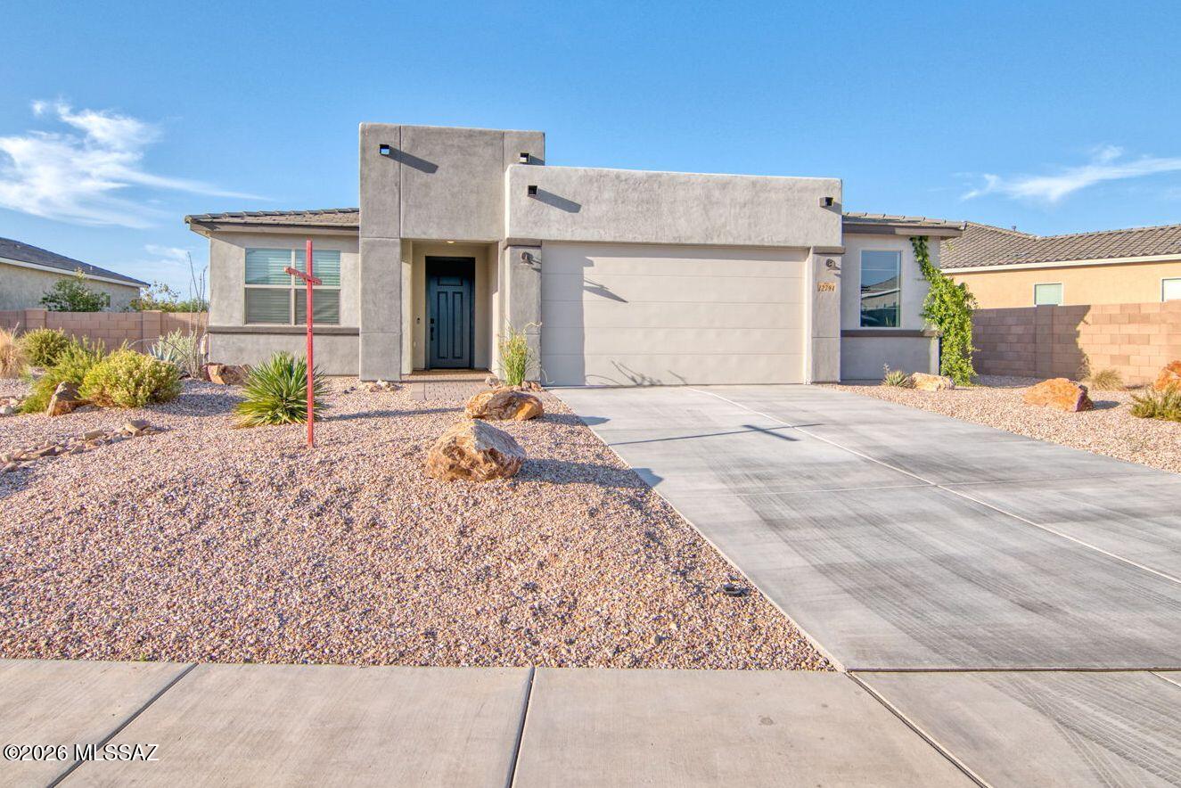 This beautiful, professionally designed home, with a gorgeous, upgraded interior and backyard with a view, is offered FURNISHED and ready for you to move in. This gated, 4 bedroom home is in perfect shape and as a former model, features all the upgrades (170K) you can imagine.  The primary bedroom features beautiful views, extra large walk in shower and a walk in closet.  The gorgeous kitchen has a gas cooktop, ample storage, ENERGY STAR appliances, large island with a granite countertop, a walk in pantry and beautiful cabinets.   The great room has 12 foot sliders showing off views to the backyard and green space.  The three guest bedrooms include a wonderful separate guest suite with a full bath, and large closet.  This space is perfect for guests or family member needin separate living space.  A dedicated office/bonus room with french doors give the home needed space for your business, toy or hobby room.  The oversized garage has epoxy floors with space for exercise equipment or hobbies.  Ceiling fans everywhere, a north south orientation, and Energy Star Qualifications make this home comfortable and efficient.  The larger lot is professionally landscaped with beautiful plants, view fencing showing the large greenspace in the back, artificial grass and a large built in barbecue.  Included outdoor furniture will add to the enjoyment of this home. Come see this home, you will love it!