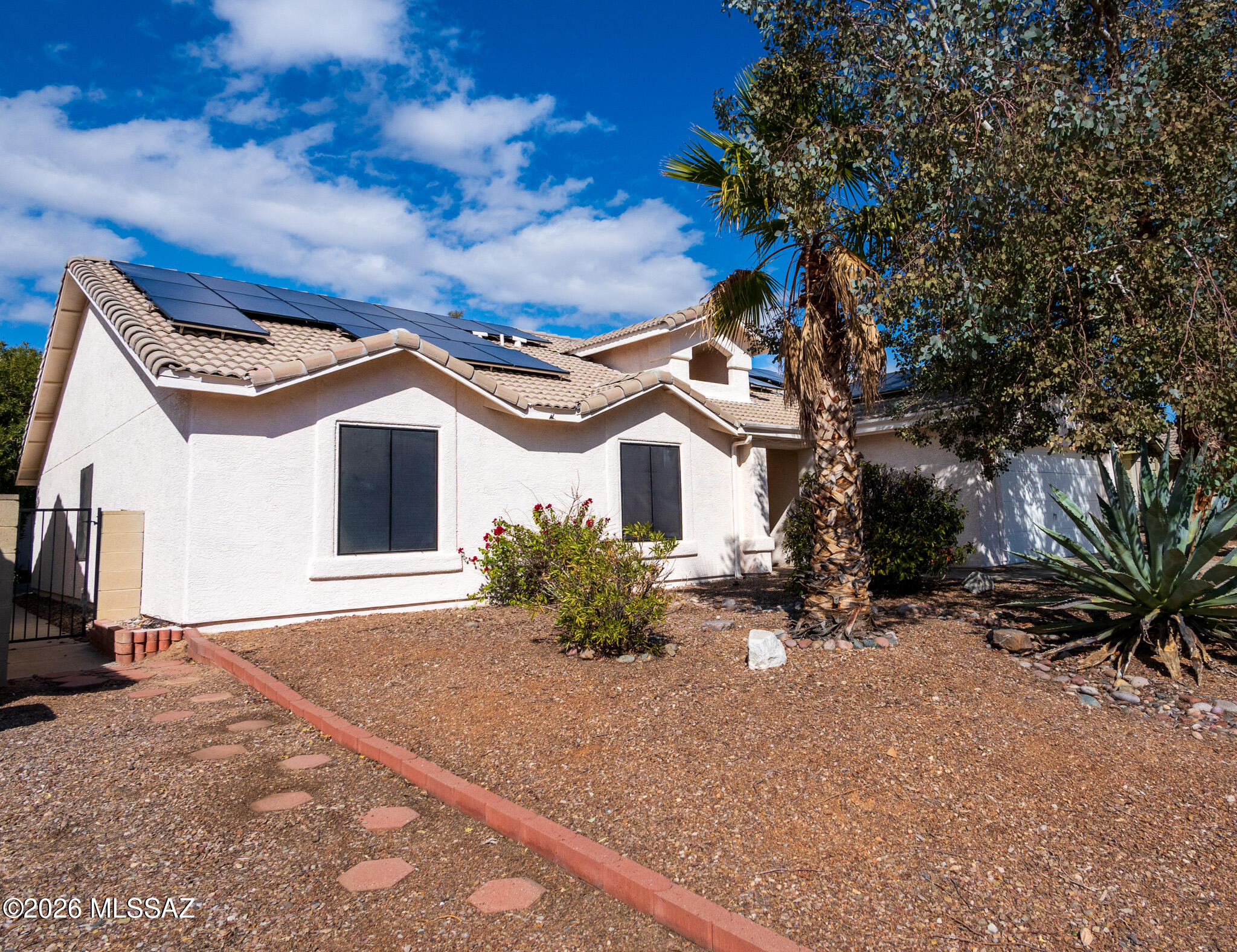 Text for a Walkthrough Video/more info. SOLAR SYSTEM and Vail Schools 4 Bedroom/2 Bathroom + Family Room 2156sf One-story Home. Amenities include; updated Kitchen with Stainless Appliances + newer Countertops; Master BR Suite w/ French Doors to access the Patio, walk-in closet, + private Bathroom w/ dual vanities; Ceramic Tile Floors in living areas + Carpeted BRs; Gas Fireplace in the Living Room; Central A/C; Laundry Closet w/ Hookups; and 2 Car Attached Garage. Private Backyard w/ Covered Patio, Turf, + trees/shrubs for shade. Located near area Schools + walking distance to Purple Heart Park w/ skate park, dog park, + splash pad. NO HOA. Tenant pays all utilities, but Solar System keeps Annual electric bills very low. 12mo minimum Lease, Costs are: Non-refundable $50/adult Application, $2150 Security Deposit, $150/pet with approved pet, $400 cleaning.