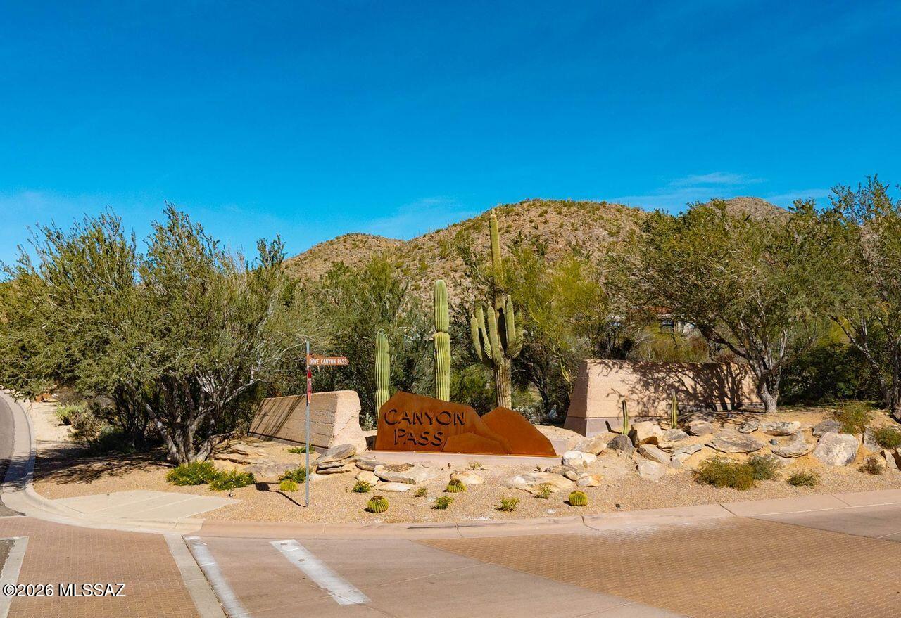 Nestled inside the prestigious guard gated Canyon Pass at Dove Mountain, this premium 2.32 acre homesite offers a rare opportunity to build your dream home surrounded by the stunning Sonoran Desert! Luxury living is an understatement here! The Dove Mountain area offers an abundance of golf courses, hiking trails, shopping, dining and so much more. (There are architectural plans available that have been through the approval process, That can be negotiated with the sale.)