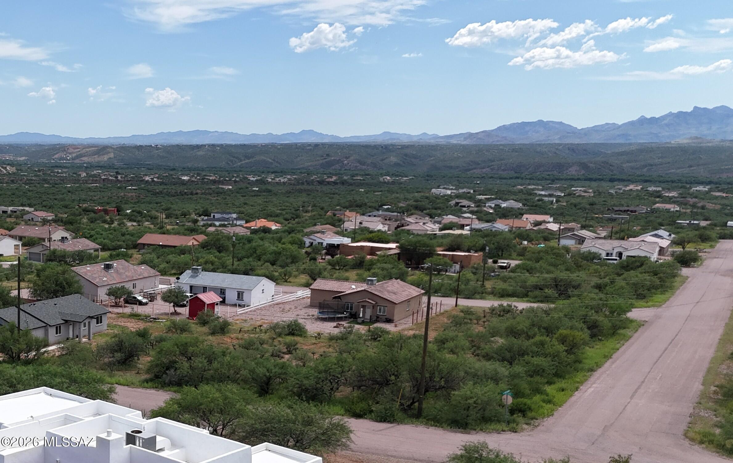 Nice flat corner lot with great mountain views.  Electric and water at the street.