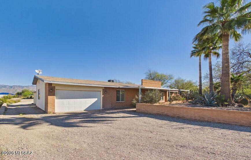 Spacious and versatile, this property offers a 1,989 sq. ft., 4-bedroom, 2-bath main home, plus a 1,170 sq. ft. 2-bedroom, 2-bath guest house, all set on a generous .80-acre lot. The main residence features tile flooring throughout, a flexible 4th bedroom (ideal for a game room, office, or home gym), and a beautifully designed kitchen with a large island, perfect for gathering and entertaining. Enjoy mountain views from the backyard along with the added value of a 1-year-old HVAC system. The detached guest house includes its own full kitchen, laundry room, covered back porch, and an approximately 4-year-old HVAC system, making it ideal for extended family, guests, or potential rental income. The expansive lot is a blank canvas with plenty of room for RV parking, boat storage, work trucks, or additional vehicles, and with no HOA, you'll appreciate the freedom and flexibility this property provides.