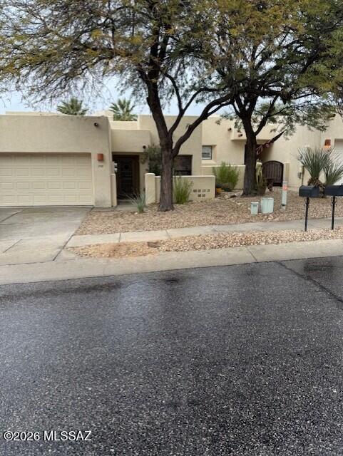 Location, Location, Location, convenient to all Oro Valley and Tucson shopping and amenities.  This Ron Robinette designed 3 bedroom, 2 bath, 2 car garage with a covered patio is now available.  It features, high ceilings, family room off the kitchen with a fireplace and a covered rear patio.  Home also has solar for low electric bills.  Year yard is enclosed with a high block wall for privacy.  Hurry this will not last.