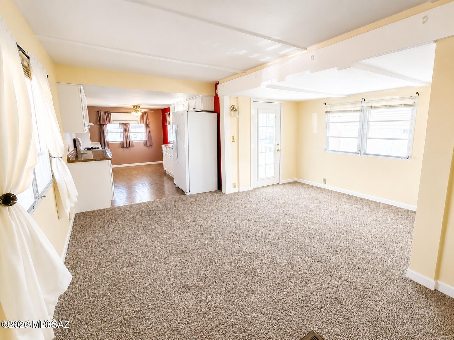 Enjoy easy Arizona living in the welcoming 55+ San Pedro RV Resort! This move-in ready 1-bedroom home offers a comfortable layout with an enclosed Arizona room, two efficient mini-split heating and cooling units, stack washer and dryer, covered carport, and storage shed. Recent improvements include exterior and living room paint, repaired exterior steps, and a recoated roof. Community amenities include pickleball, bocce ball, shuffleboard, horseshoes, dog park, two clubhouses, indoor and outdoor pools, and indoor spa. Convenient to shopping and dining. Home only; land is leased. Lot rent is $492/month. Buyer subject to park approval.