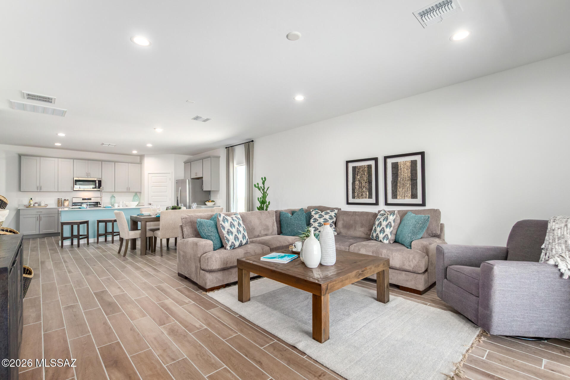 Brand-new construction and brand-new floorplan within Rocking K, a master-planned community. This single-story home boasts an open concept layout that caters to comfort and style. This home is 1815 square feet of living space. The living area is accentuated by 9 feet high ceilings. Quartz countertops in kitchen, upgraded cabinets, and stainless steel appliances including a microwave, dishwasher and gas range. The primary suite has a large closet for ample storage and an en-suite bathroom with a double vanity. Energy efficiency is at the forefront of this Zero Energy Ready home's design, boasting spray foam insulation, dual pane low-emissivity windows and ceiling fan prewires to ensure comfort year-round. Photos are of model Home.