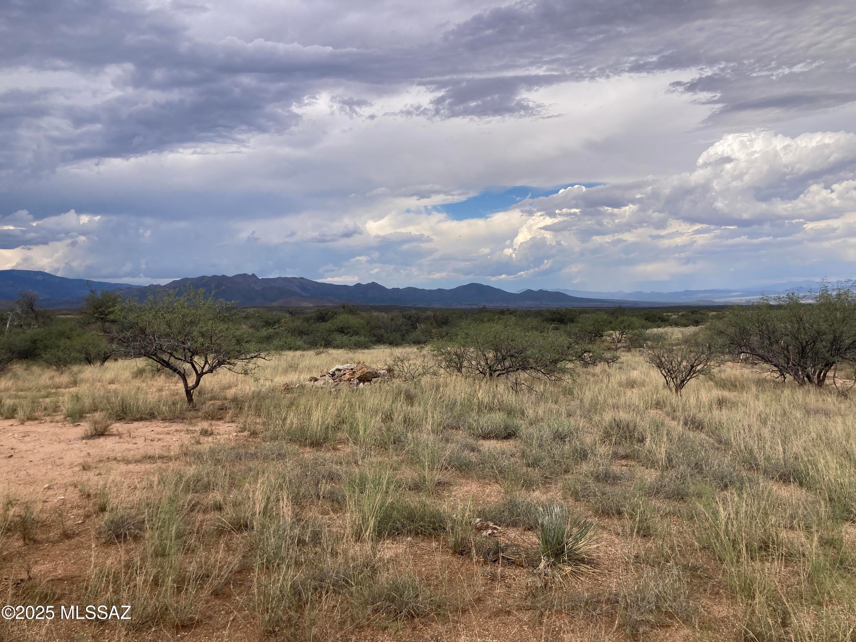 33.40 Acres | Approx. 1.5 Miles from I-10 | Existing Electric & Septic Infrastructure
Looking for room to spread out and enjoy the Arizona desert? This unique offering includes two adjoining parcels totaling approximately 33.40 acres, located just 1.5 miles from I-10's Skyline Road interchange (Exit 299). Enjoy the open space and privacy of rural Arizona while remaining conveniently accessible to the interstate. Unlike completely unimproved acreage, the property offers existing utility infrastructure, including an electric pole and transformer, as well as an existing septic system. The electric meter has been removed, and Cochise County records reflect a 1985 septic approval for a two-bedroom residence with a 1,000-gallon tank. The property features natural desert terrain. Water was historically hauled to the property, and an existing water storage tank remains on-site. No well has been identified, and the condition and functionality of the water storage tank and any associated equipment have not been verified. Two older, unaffixed mobile homes are located on the property and will remain at closing. Seller will not remove the mobile homes, abandoned vehicles, personal property, or any existing debris. Property is being sold strictly As-Is, with all existing items remaining on-site. Whether you're looking for a private desert retreat, recreational acreage, or a future homesite, this property offers plenty of space and possibilities! All utility information, including electric, septic, and hauled-water storage infrastructure, is provided for informational purposes only. Buyer is responsible for independently verifying utility availability, condition, functionality, service requirements, legal access, zoning, development feasibility, and suitability for intended use.