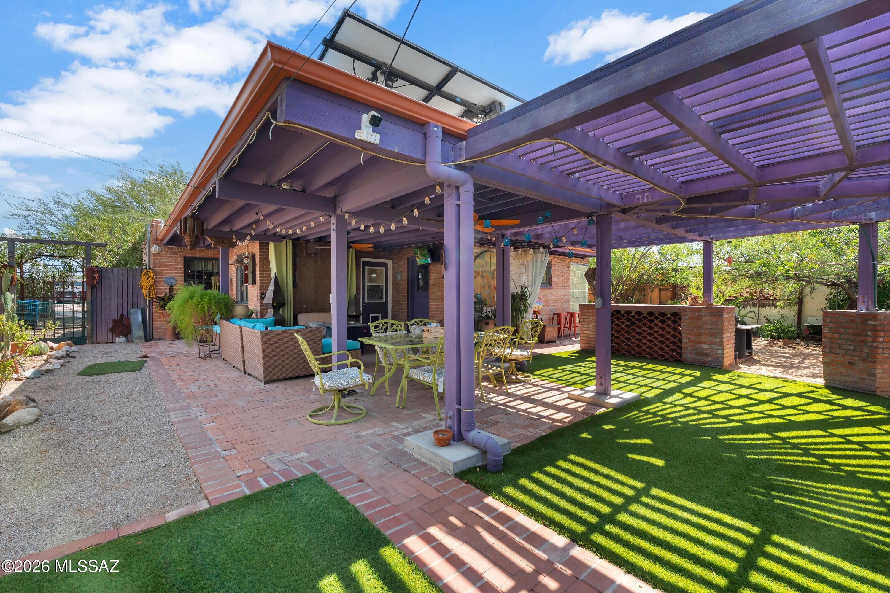 This home has it all, thoughtfully designed for comfort, style, and seamless indoor-outdoor living in Midtown Tucson, minutes from Reid Park, the University of Arizona, and Downtown dining and nightlife! Rare 1948 double-brick territorial, extensively remodeled with an expanded primary suite featuring a glass block walk-in shower and heated tile floors. Original character blends with modern upgrades and dual-pane windows. Energy-efficient systems include owned solar and dual cooling. Expansive covered patio opens to a lush desert oasis with mature fruit trees. Detached workshop with 220 power and mini split. A rare opportunity to own a beautifully restored home combining historic Tucson character with modern, efficient desert living. Don't miss your chance to own this very special home!