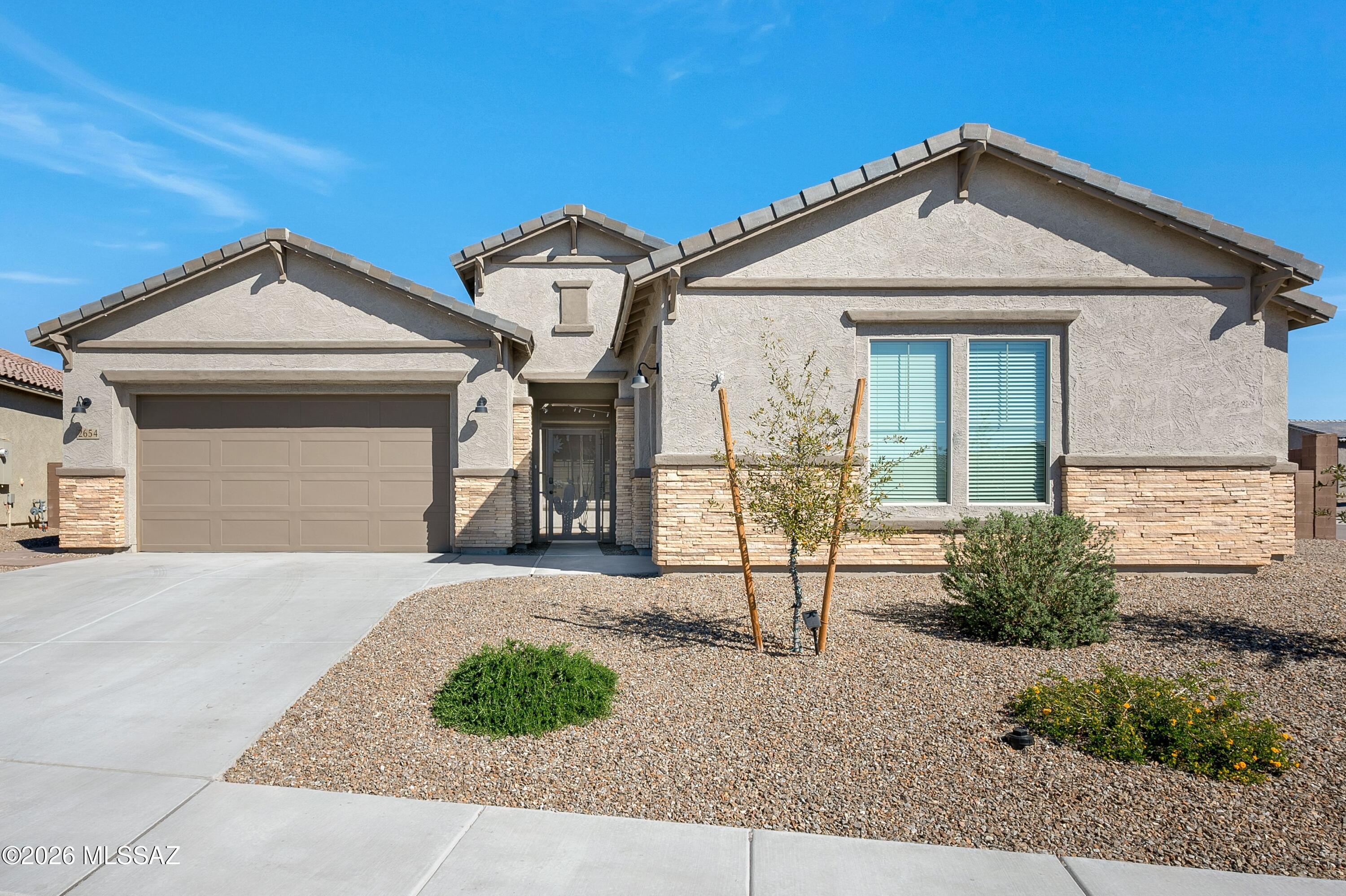 Experience exceptional living in this stunning 3,241 sqft Patagonia Spanish-style masterpiece, nestled on a corner lot within the secure gates of Ironwood Ridge Estates! This single-story Pulte build boasts a split floor plan, perfect for families and entertaining. The main house features a spacious primary suite with a walk-in custom closet, double vanity, and a luxurious shower, plus an ensuite second bedroom. The gourmet kitchen showcases granite countertops, upgraded 42'' upper maple cabinets, and a walk-in pantry. The kitchen flows seamlessly into the dining room and living space. Additional perks include high ceilings, a finished laundry room, and a private courtyard.  ALL-GENERATION GUEST LIVING QUARTERS includes bedroom, restroom, full kitchenette, along with its own laundry room, garage and private entry! The backyard oasis is perfect for entertaining.Enjoy tranquil evenings beneath the pergola, illuminated by the warm glow of a gas fire pit and surrounded by thoughtfully designed landscaping. The above-ground resistance pool provides a unique wellness feature, offering the perfect setting for low-impact cardio and muscle-strengthening through water resistance-all from the comfort of your own backyard.Turn-key and meticulously kept - don't miss out on this incredible opportunity!
