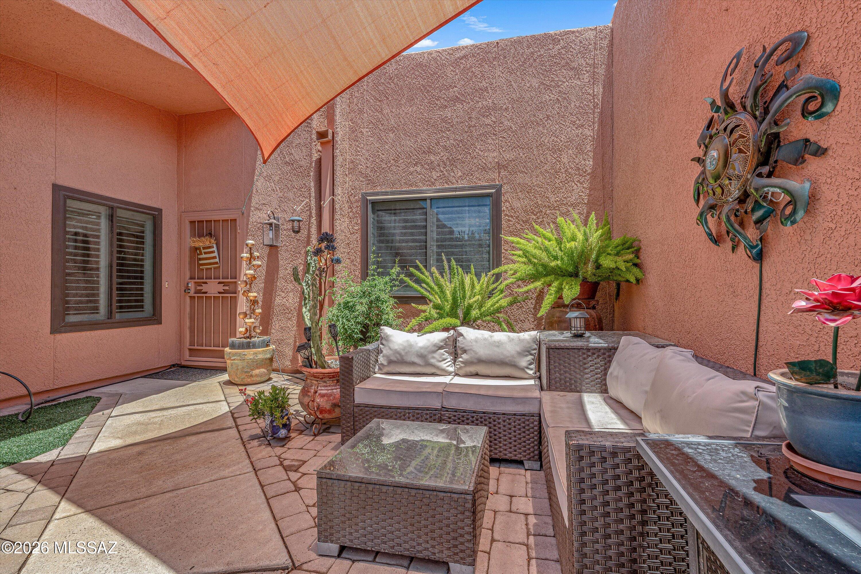C;harming, beautifully maintained & move-in ready, this two-bedroom townhouse offers comfort and style in the desirable Wrightstown Square subdviision. Thoughtfully updated throughout the home features plantation shutters, soft luxury laminate plank flooring, gas fireplace, newer interior doors, sky light & expansive windows that fill the vaulted ceilings with natural light. Master bathroom has been remodled with a spacious double walk-in-shower, marble vanity, and recently updated toilets in bathrooms. The spacious decorative kitchen offers an open, airy layout with abundant of natural light, soft close wood cabinetry brushed nickel hardware and stainless steel appliances. 
The backyard showcases striking desert cactus landscaping, artificial turf grass, and an easy-care drip system.