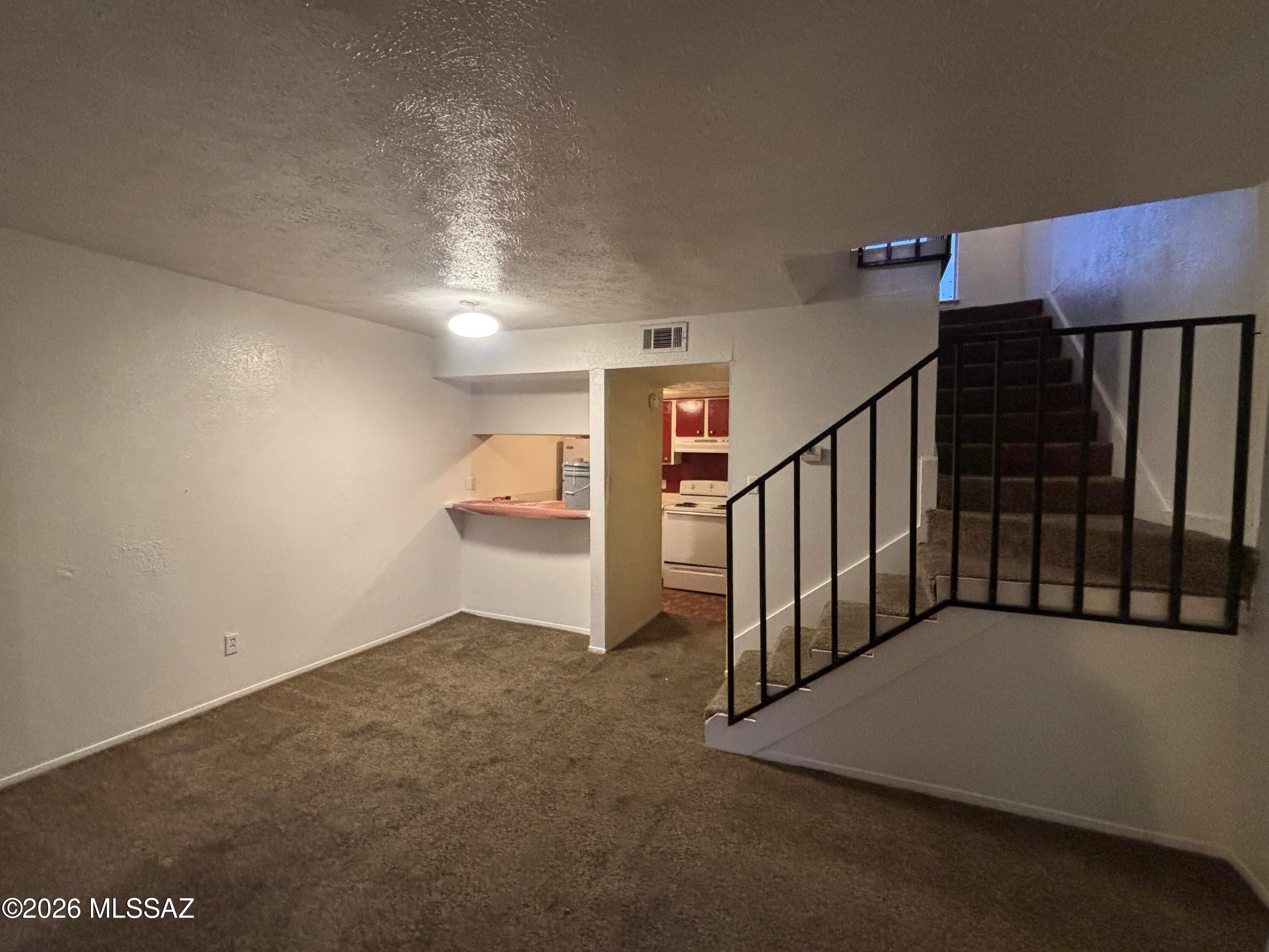 This well-kept 1-bedroom, 1.5-bath loft-style condo located on Tucson's east side. The first floor features a breakfast bar, living room, and a half bath. The kitchen is equipped with a stove, refrigerator, and dishwasher.
Upstairs, the loft-style bedroom offers generous natural light through large windows and includes a full bath.
Community amenities include a pool, along with covered utilities for water, trash, and sewer. The property is situated close to retail, dining, medical services, and major transportation routes