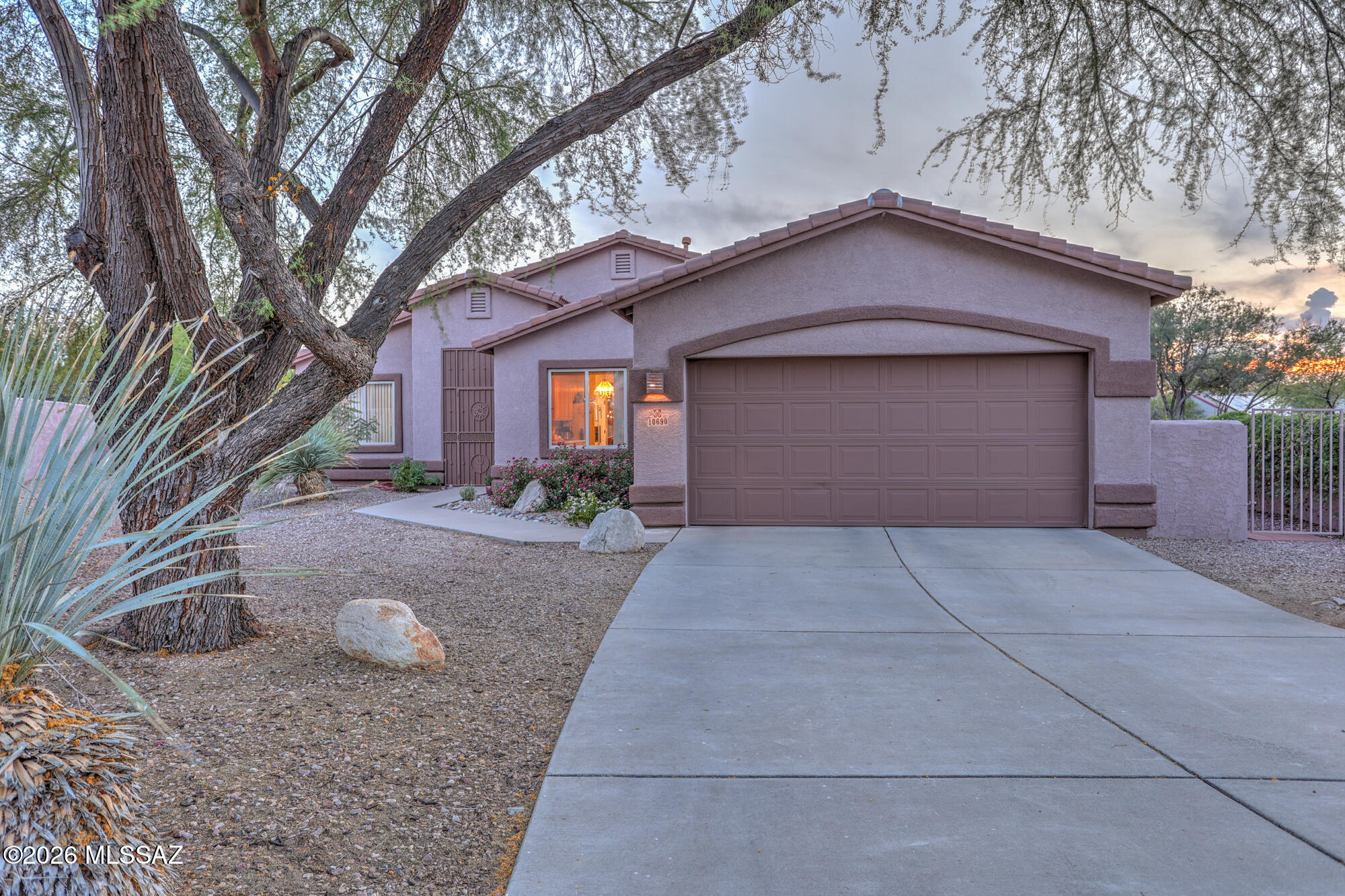 Seller will entertain offers between $399,999 and $410,000.  Welcome home to this beautifully maintained home tucked away on a quiet cul-de-sac within the highly sought after gated community of Rancho Cancion on Tucson's east side. Set on an exceptionally large lot, this property offers a rare combination of space, privacy, and lifestyle value.  From the moment you arrive, the pride of ownership is unmistakable, with thoughtful care evident throughout the home and grounds. The expansive lot opens the door to endless possibilities; ideal for outdoor entertaining, gardening, or simply enjoying the peaceful desert setting.  The backyard features a dedicated workshop; perfect for hobbies, projects, extra storage, or a functional workspace, while still providing ample room to relax and unwind.  Enjoy the serenity of cul-de-sac living with the added security of a gated neighborhood, and a location that offers both tranquility and convenient access to shopping, dining, and recreation. Homes offering this level of space, condition, and setting are rarely available at such an attainable price point.  Dont miss out and schedule a showing ASAP!