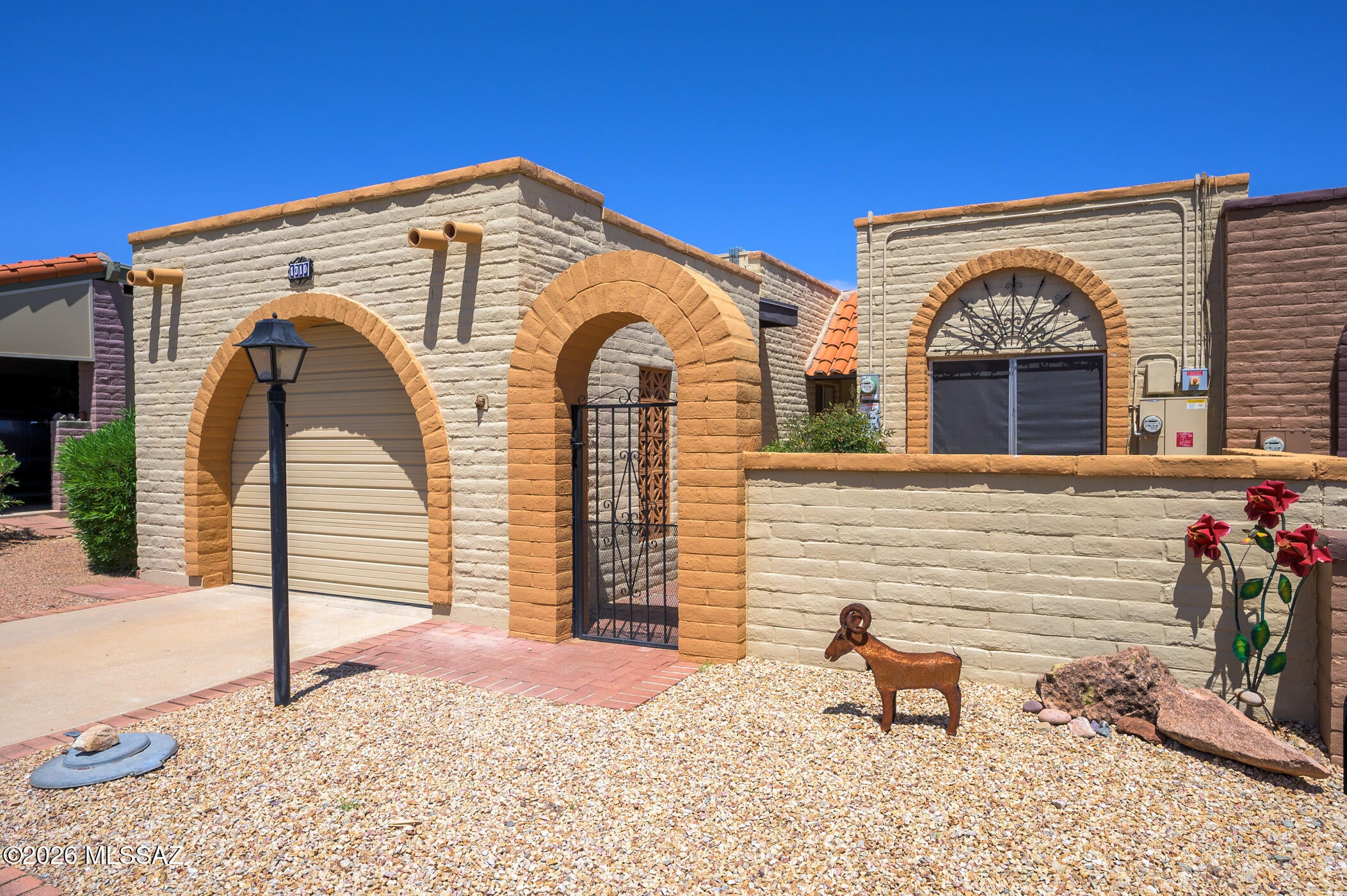 Discover the perfect retreat for your Southwest Arizona retirement in this beautifully maintained townhouse nestled within the sought-after Desert Hills 2 community. From the moment you arrive, an inviting front archway welcomes you into a private courtyard--an ideal spot to sip your morning coffee while admiring the Santa Rita Mountain views.  Step inside to find an open-concept living and dining area that offers ample flexibility to suit your personal style and treasured art pieces. The bright, spacious kitchen is flooded with natural light from a generous skylight and features sleek stainless steel appliances, making meal preparation a pleasure.  The large primary suite is a true haven, enhanced by custom California closets to keep everything organized. An extended area within the suite provides the perfect space for an office, craft room, or quiet reading nook--tailored to your retirement passions. A comfortable guest bedroom with a built-in Murphy bed also adds further flexibility.  Enjoy the ease of a low-maintenance lifestyle, with a solar system designed to reduce your utility costs and support eco-friendly living. When it's time to unwind, your private backyard patio is the perfect sanctuary to witness breathtaking desert sunrises and sunsets, framed by panoramic mountain vistas.  With a single-car garage and a vibrant, welcoming neighborhood, this is more than just a home--it's your gateway to the best of active retirement living in Green Valley. Don't miss the opportunity to make this delightful home your own!