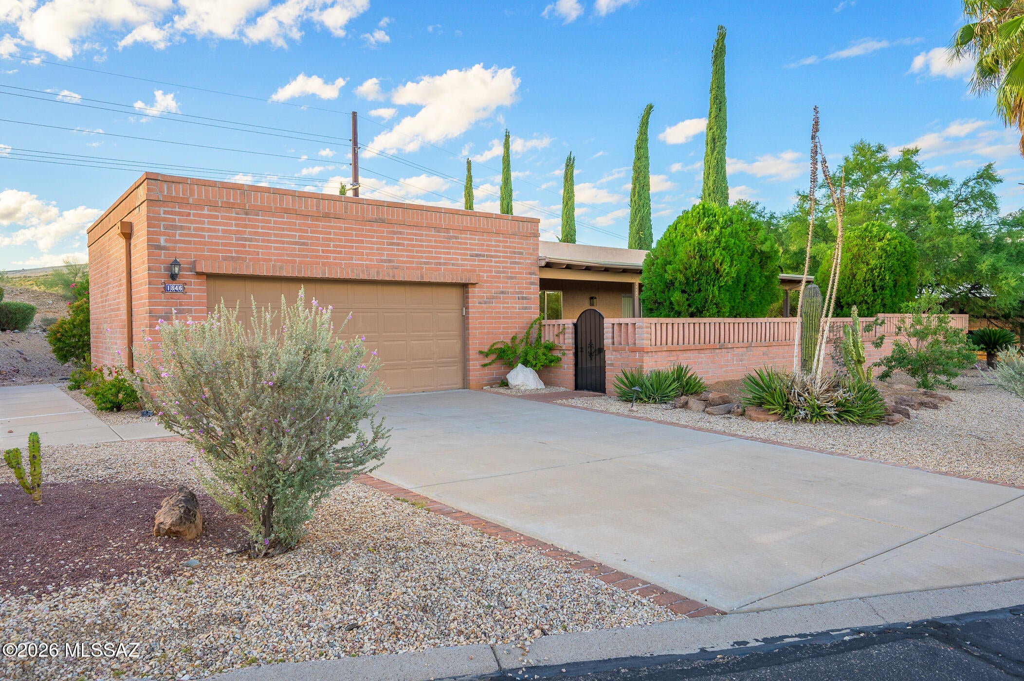 Welcome to easy retirement living in the scenic southwest corner of Green Valley, where rolling hills and mountain vistas create a peaceful backdrop for your next chapter. This charming 2-bedroom, 2-bath home is situated in a friendly 55+ community, offering the perfect balance of tranquility and opportunity for an active lifestyle.  The exterior is classic slump block construction for easy maintenance.  As you step inside, a large skylight in the foyer bathes the space in natural light. The kitchen also benefits from two additional skylights, creating a bright and cheerful environment for cooking and entertaining. This thoughtfully designed space includes ample room for casual meals in the kitchen, where culinary creativity can thrive.  The open living and dining areas seamlessly flow together, creating an ideal setting for hosting friends or simply enjoying cozy family gatherings.  Sliding glass doors invite you to step onto the spacious wrap-around patio, perfect for morning coffee or evenings under a starlit sky.  Plus, you'll enjoy full membership in Green Valley Recreation, where clubs, fitness classes, and social events help you stay active and engaged all year long.  Discover a welcoming retirement oasis where the beauty of nature and the warmth of community spirit abound. Don't miss the chance to make this home your own in one of Southern Arizona's most desirable retirement destinations!
