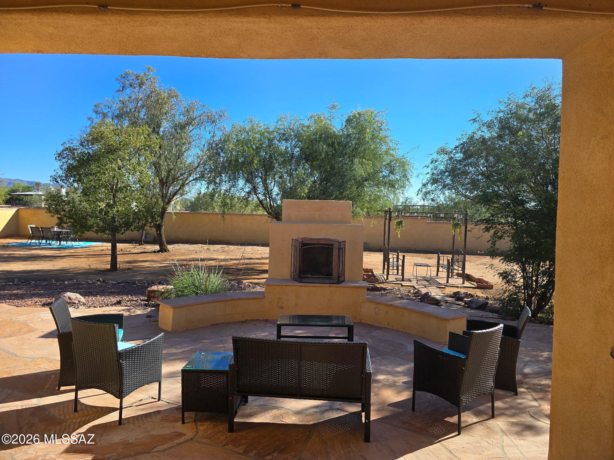 This is your chance to own a sprawling 5-bedroom, 4-bathroom, 3,500 sq. ft. single-story home on an acre-plus lot in sought-after Tierra Linda gated community!

Spacious & Versatile Interior

Step inside to a freshly painted interior featuring easy-care tile throughout main living areas and plush carpet in each of the generously sized bedrooms. The flexible floor plan offers multiple living and dining spaces to fit your family's lifestyle.

Chef's Dream Kitchen

The gourmet kitchen features granite countertops, a 5-burner gas cooktop, double wall ovens, stainless steel appliances, a brand-new dishwasher installed this year, and dedicated Reverse Osmosis (RO) drinking water connected directly to both the kitchen sink and refrigerator. Primary Suite Retreat

The main bedroom suite serves as a true private sanctuary, complete with his-and-her vanities, two walk-in closets, a large soaking tub, and a double shower.

Outdoor Living & Storage

French doors open to an expansive flagstone patio featuring a built-in outdoor fireplace--perfect for relaxing under bright night skies. Parking and storage are effortless with an oversized 3-car garage and a large driveway with ample space for extra vehicles.

Key Upgrades & Systems

Whole-home water softener system
Reverse Osmosis (RO) drinking water unit at kitchen sink & fridge
Fresh interior paint
AC replaced in 2020
Dishwasher replaced this year
Roof inspected and cleared

The Best of Both Worlds

Enjoy peace, local wildlife, and total desert serenity--all while staying close to everyday essentials. Located just 5 minutes from Marana High School and the Wade McLean Pool, within 3 miles of convenience stores and local taco trucks, and under 10 miles from major shopping and dining centers.

Unmatched space and value just outside of town! Call the listing broker today to schedule your private tour!