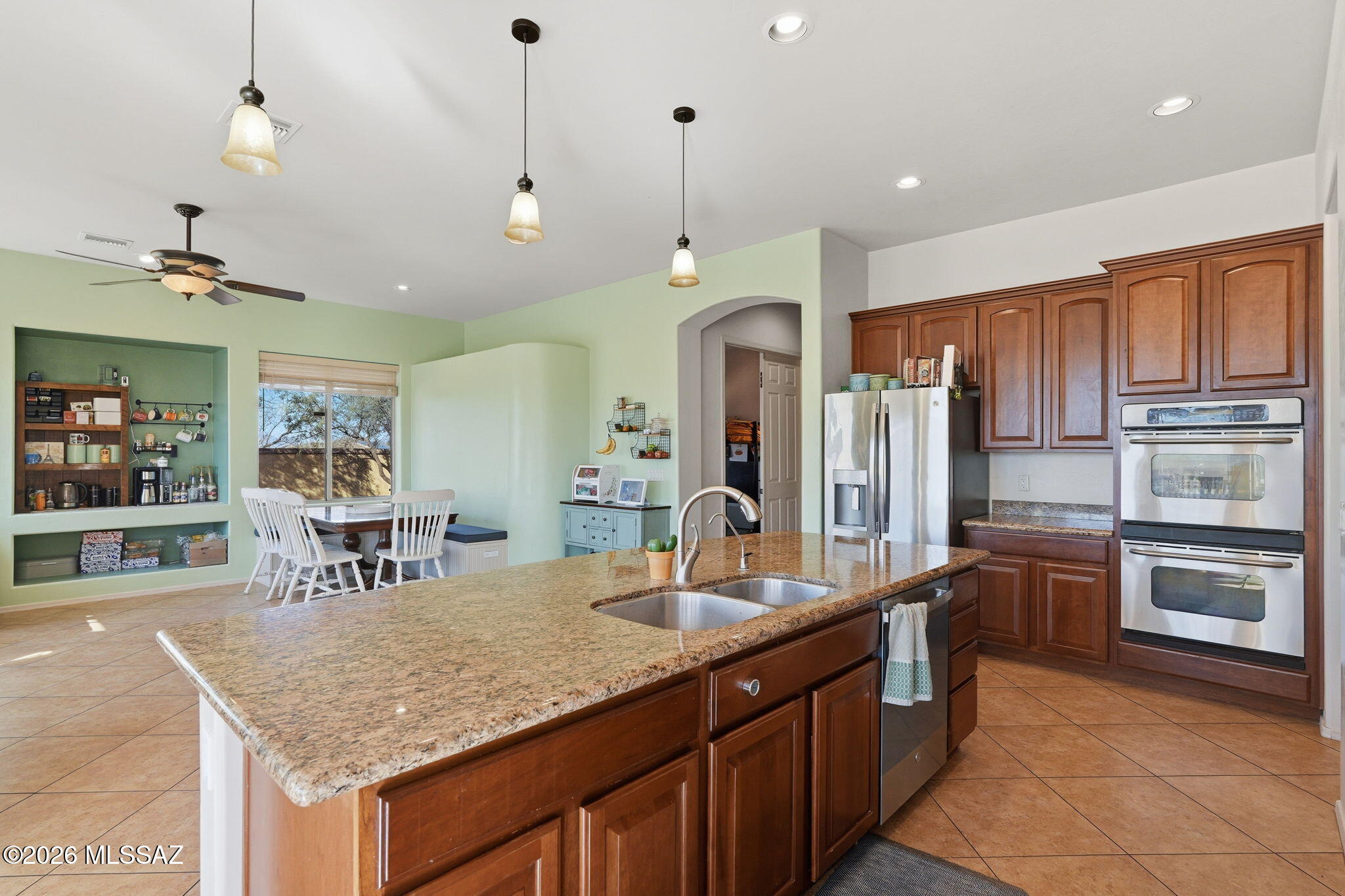 This is your chance to have over an acre of property with a 5 bedroom 3500 square foot home! Features include, ceramic tile through all but the bedrooms, whole home water softener and RO water to the kitchen sink drink faucet and the fridge, 3 car garage. New AC in 2020, Double wall oven and gas range, granite counters. All in a gated community!