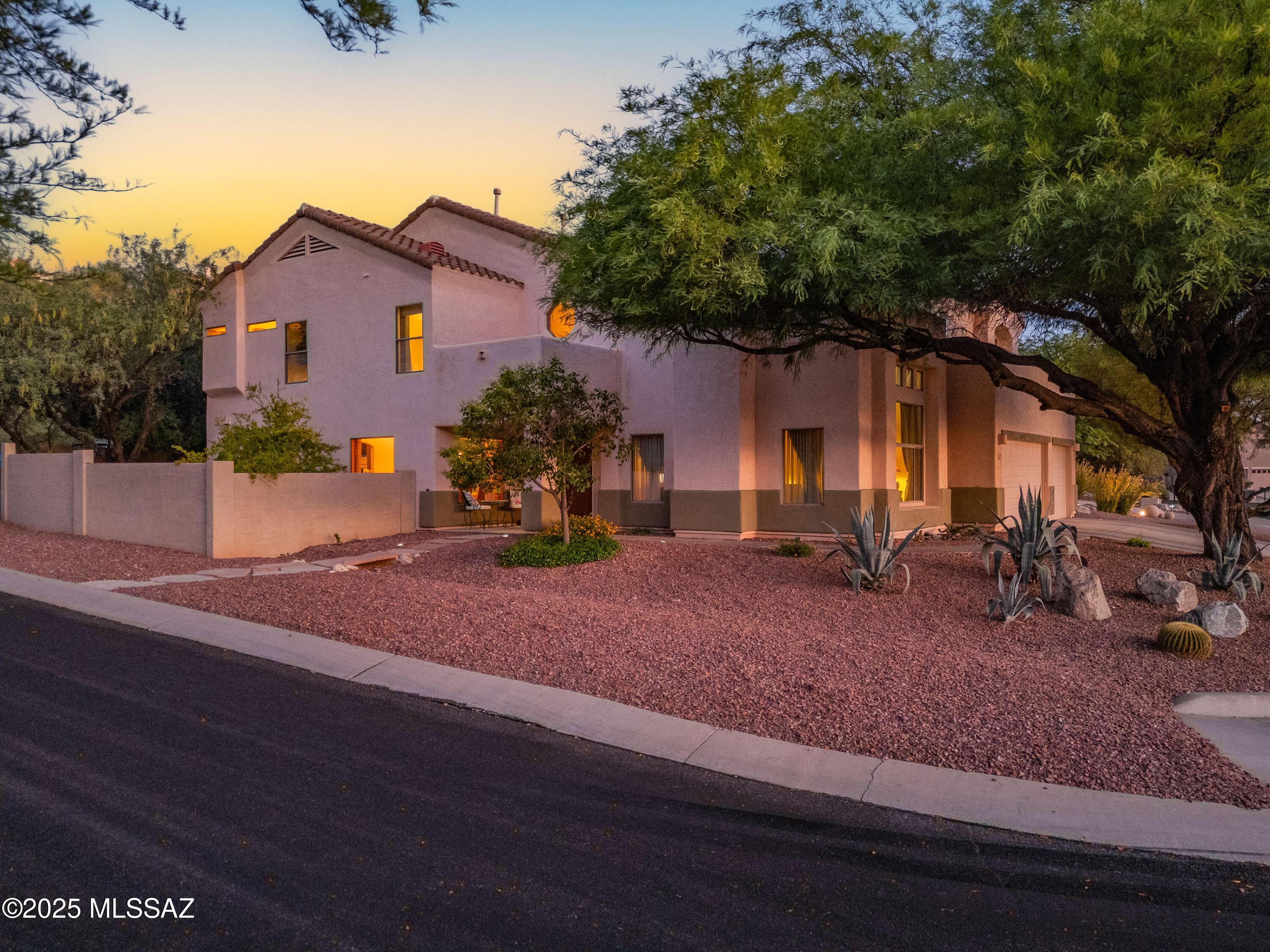 Stunning Designer Home with Luxury Upgrades & Mountain Views! From the rich walnut floors to the elegant lighting, this beautifully updated home is packed w/high-end finishes & thoughtful details throughout. The remodeled gourmet kitchen features custom floor-to-ceiling soft-close cabinets, granite countertops, a stylish tile backsplash, double sink, gas cooktop, double Dacor ovens & a built-in Sub-Zero refrigerator. A cozy eat-in nook opens to the backyard through classic French doors — perfect for morning coffee or casual dining. 
Downstairs offers a private br &  full bath just off the spacious family room — ideal for guests or multi-generational living. The bright & airy living room is perfectly positioned to capture stunning desert & mountain views. Upstairs, a spacious loft with custom built-ins makes a perfect home office or creative space. The split owner's suite offers privacy and comfort, featuring travertine floors, dual glass sinks, custom counters, a tailored walk-in closet, and more.

Step outside to your private backyard retreat complete with a built-in BBQ, tranquil fountain, and a block wall for added privacy. This home is a true gem impressive from start to finish!