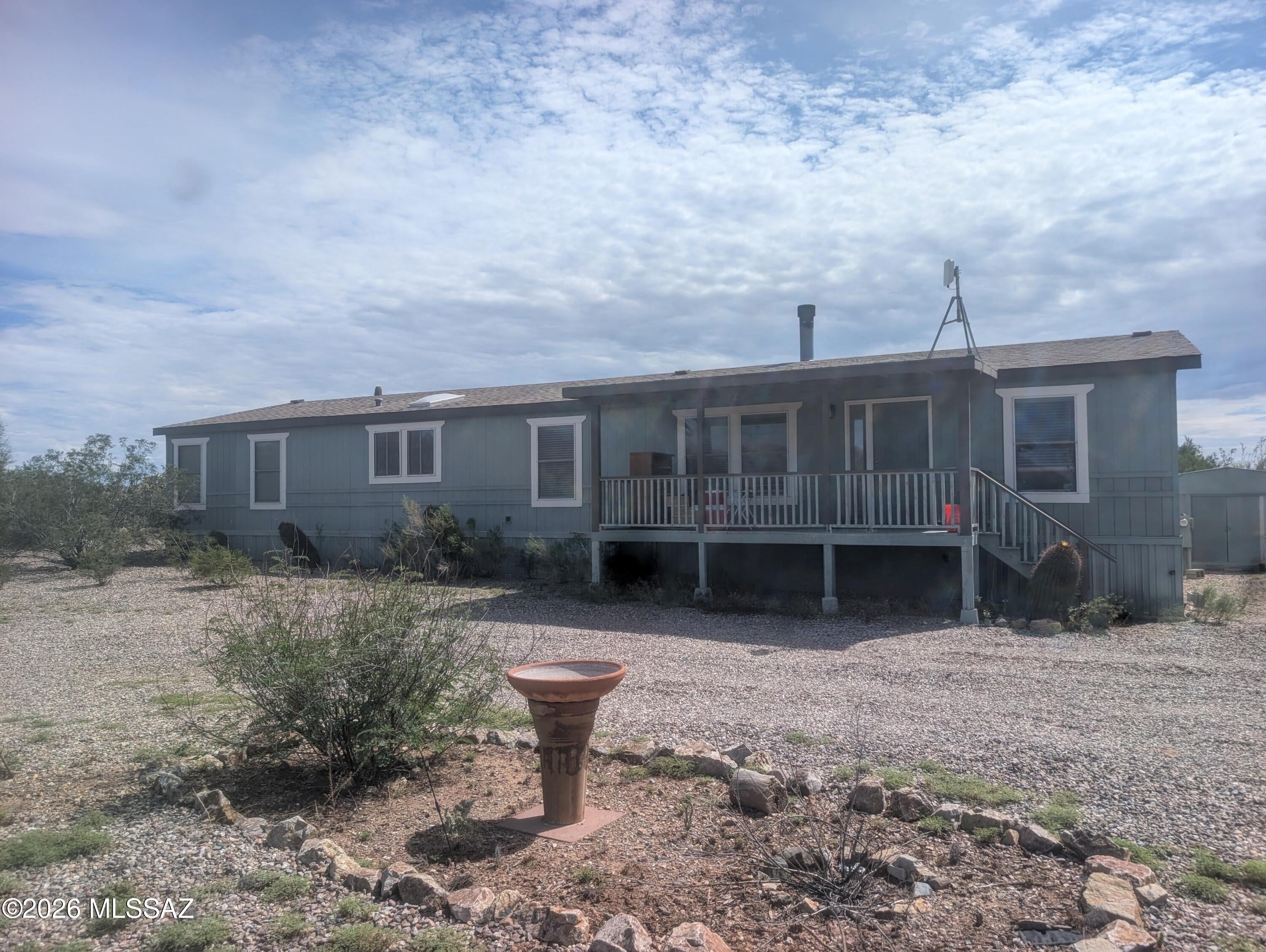 You don't want to miss this move-in ready, private desert oasis, sitting on 4.3 acres - the spacious 4-bedroom, 2,100+ sqft home offers the perfect blend of privacy, functionality, and breathtaking desert views.
Inside, you'll find a bright, split floor plan with tons of natural light, a large open kitchen and dining area + new vinyl flooring. The generously sized primary suite features a large walk-in closet with a window & luxury bathroom jetted soaking tub, lots of cabinet space & separate closet entry.  
Outside, you'll appreciate the circular driveway, expansive acreage with low maintenance landscape, and incredible panoramic views in every direction.
*RATE BUY DOWN opportunity available for qualified buyers - call agent for more details* The detached, two-car garage is equipped with a mini-split system, making it an ideal workshop, hobby space, or storage. The property also boasts an RV electrical hookup. The HVAC and the home's roof were both replaced in 2021 - while the garage's roof was replaced in 2023.

With a little TLC this home has endless potential.