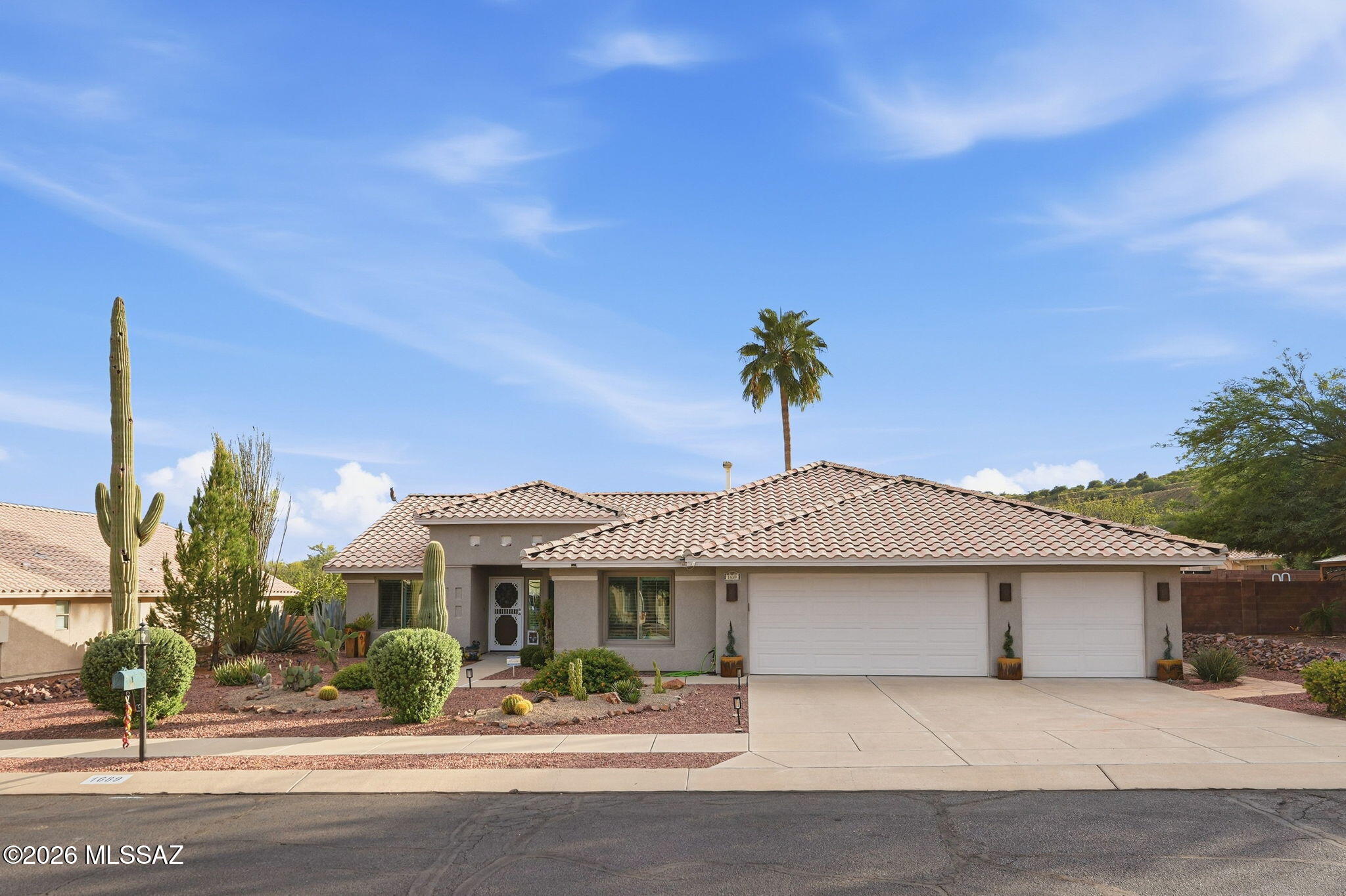 Your own Arizona retreat awaits! This four-bedroom, two-bath Sahuarita home offers approximately 1,949 square feet of comfortable living space, thoughtfully arranged with an inviting great room and a desirable split-bedroom layout. The spacious kitchen is designed for both everyday ease and entertaining, with ample storage, generous counter space, a convenient breakfast bar, and a pantry. Don't miss the list of upgrades including a new HVAC!

The private primary suite offers a peaceful escape, complete with a bay window, walk-in closet, direct patio access, and an ensuite bath featuring granite counters and a walk-in shower. Three additional bedrooms provide flexibility for guests, hobbies, or a home office.

Outside, the landscaped backyard invites you to enjoy Arizona living with a private pool and ample space for lounging, dining, and entertaining. A natural arroyo beyond the yard adds a sense of openness and privacy. The three-car garage, complete with cabinetry and a workbench, provides valuable storage and workspace. Offering comfort, versatility, and an inviting indoor-outdoor lifestyle, this Sahuarita home is ready to become your personal desert escape.