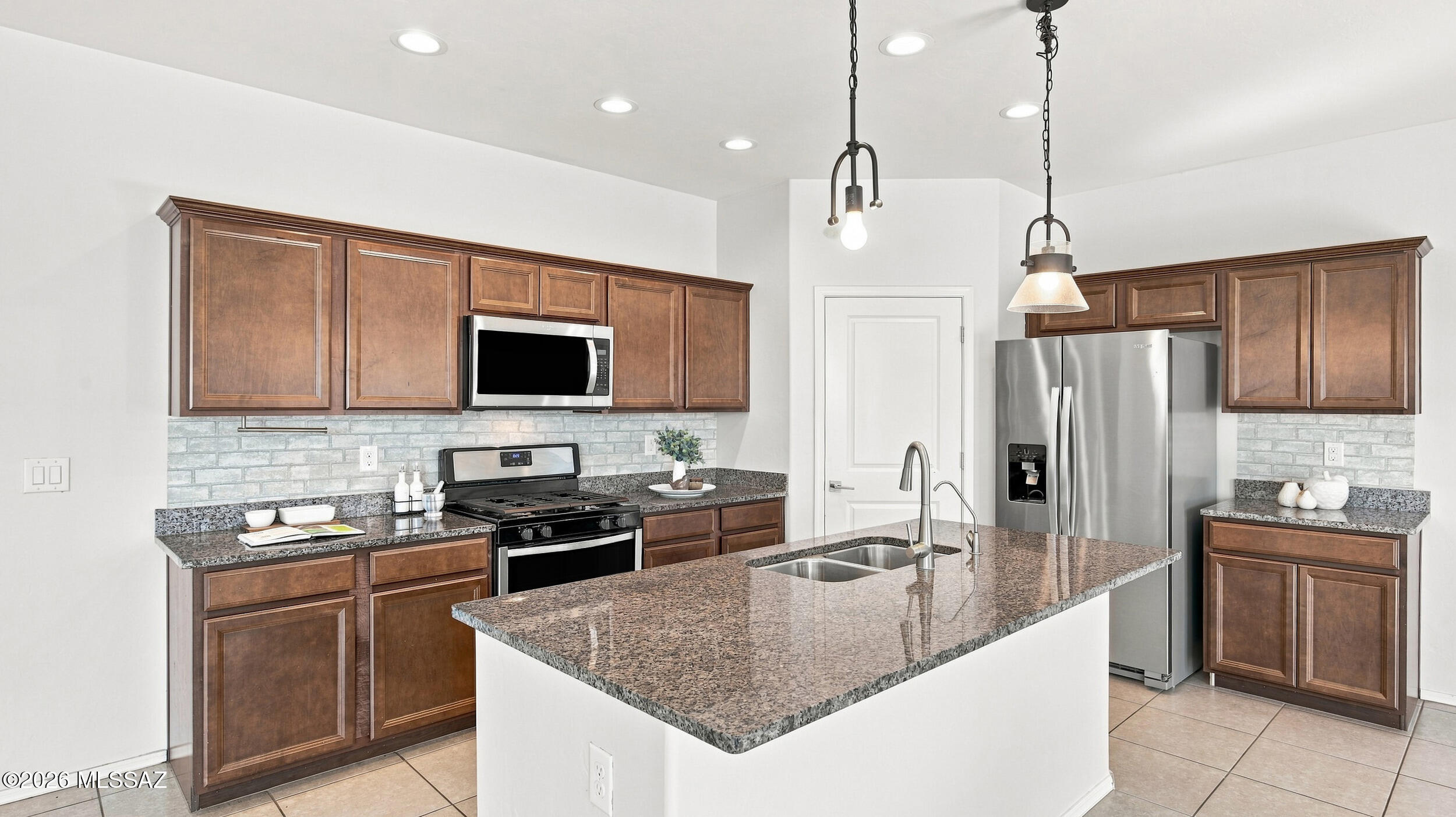 NEW Paint just completed! Beautiful 2019-built, two-story home in the desirable La Estancia community, located in the award-winning Vail School District. This 3 bed, 3 bath home features an open-concept living room and kitchen, perfect for everyday living and entertaining. Upstairs offers a versatile loft ideal for a home office, media room, or play space. Spacious bedrooms and well-appointed bathrooms provide comfort and functionality. Enjoy a fully finished backyard designed for low maintenance and year-round use. A great opportunity to own a newer home in a sought-after location.