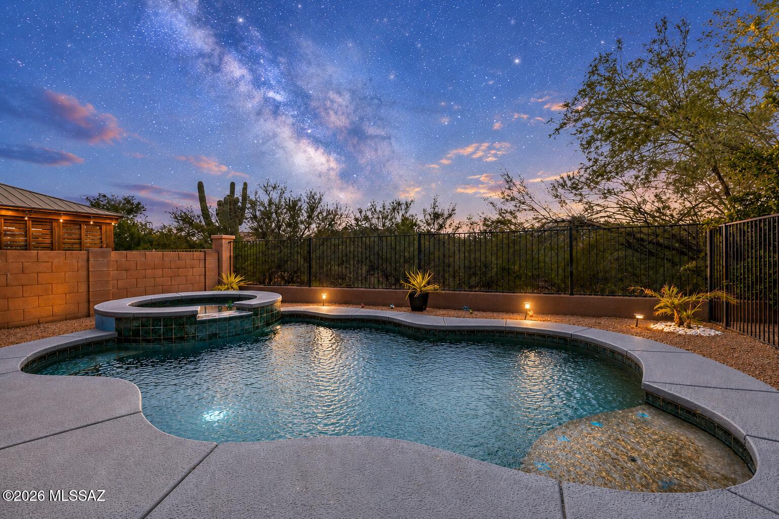 WE STAND ABOVE THE COMPETITION! This is where space, upgrades, energy efficiency and resort-style living come together in a home that truly separates itself from  every other! With just over 3,600 square feet, this impressive home is ideal for a large or multigenerational family. While other homes on the market may offer similar square footage this home delivers so much more with a private pool/spa NO BACK NEIGHBORS, and OWNED solar with no lease to assume & produces 2.2mwh per month while only using 1.7kwh per month! Enjoy an updated kitchen, first-floor bedroom, and an incredible backyard designed for entertaining.The versatile floor plan provides room to gather while still giving everyone their own space. The first-floor is especially valuable for grandparents, overnight guests, an older child, or even private office. Enjoy a lifestyle that extends far beyond the property. Rancho Sahuarita is one of Southern Arizona's most recognizable master-planned communities, offering residents access to community pools and splash areas, fitness facilities, parks, miles of trails, Sahuarita Lake and an extensive calendar of activities and events--all while remaining conveniently connected to Tucson. Why settle for less when the home that offers more is waiting? Schedule your private showing TODAY and let us welcome you home!