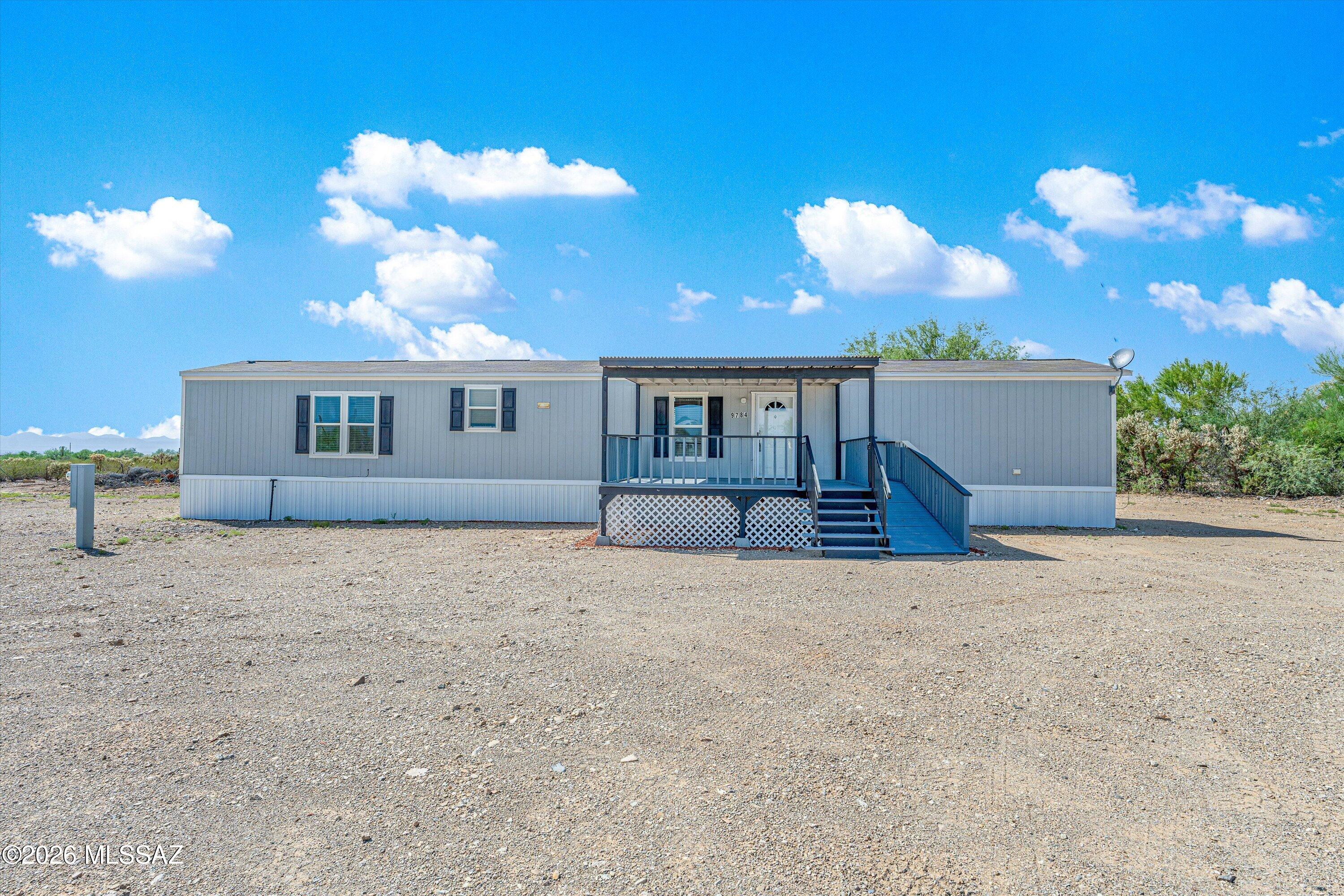 Welcome to this nearly-new 2022 Clayton manufactured home, perfectly situated on a generous one-acre lot with a big, open yard. Fresh, modern, and move-in ready, this 3-bedroom, 2-bathroom home offers comfortable single-level living with a smart, efficient floor plan.
The spacious yard is the star of the show -- plenty of room for kids, pets, gardening, or outdoor entertaining. Enjoy wide-open desert views and room to spread out, all with the peace and privacy of acreage living.
Thoughtfully built in 2022, this home combines modern construction with low-maintenance convenience. Whether you're searching for your first home, a downsized retreat, or a place with room to grow, this property delivers space, style, and value.
Don't miss your chance to own a beautiful home on a full acre.