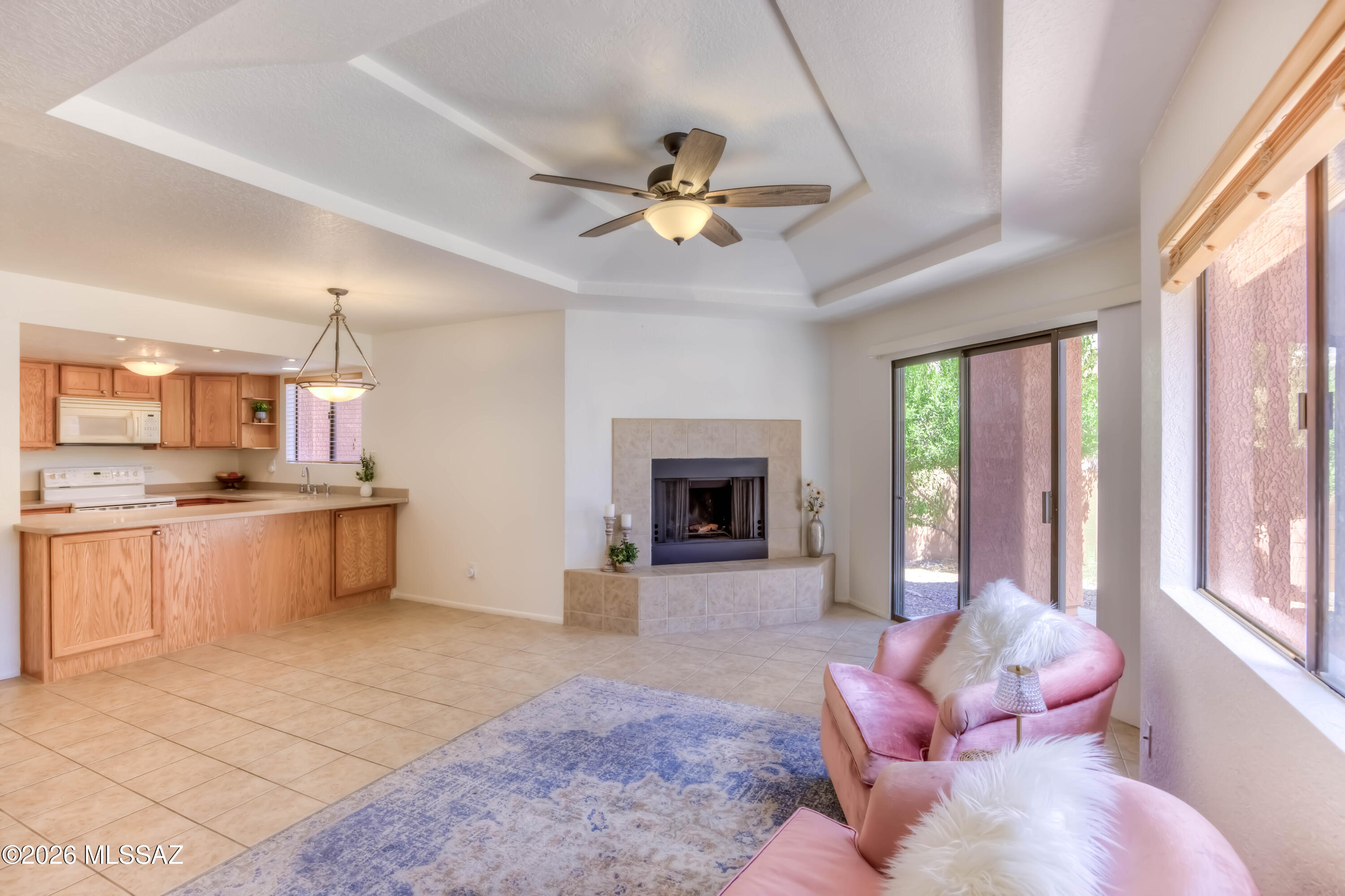 Welcome to this light-filled, ground-level retreat at Ventana Vista -- one of the rare units in the complex with truly step-free access from parking to front door, making everyday living effortless. This 1 bed/1 bath condo features no carpet, a cozy fireplace and a 2025 HVAC. The private covered patio offers a peaceful outdoor escape with no neighbors in direct view. The updated bathroom shines with a beautiful walk-in shower and grab bars throughout. Whether you're looking for a comfortable full-time residence, a lock-and-leave retreat, or an investment property, this unit delivers -- rentals are welcome with a preferred minimum of 30 days. Resort-style amenities include a pool, two spas, pickleball and tennis courts, exercise facility, and rec room. All of this in the heart of the Catalina Foothills -- minutes from world-class hiking at Sabino Canyon, top-rated restaurants, and shopping. Move-in ready and waiting for you!