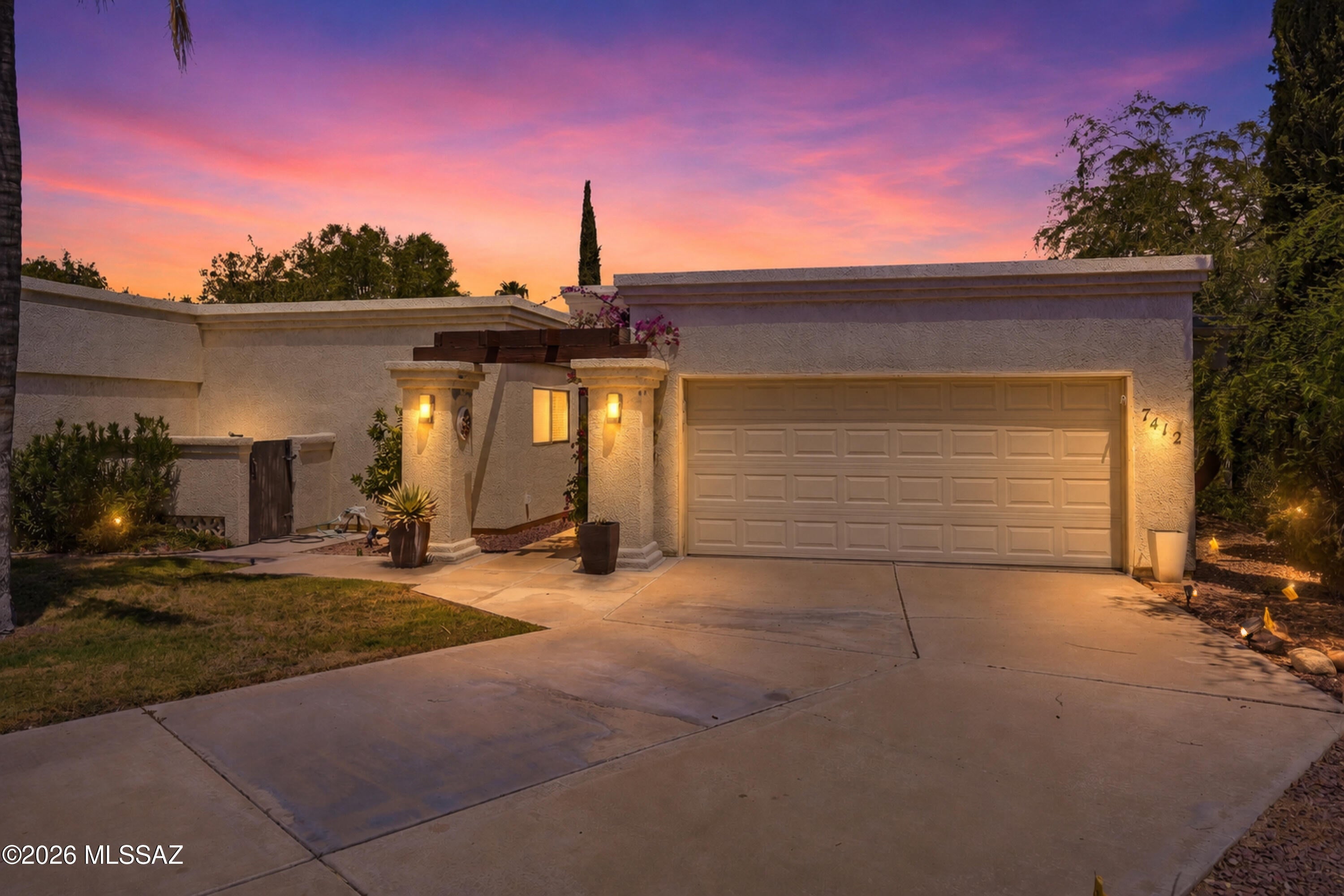 Welcome to 7412 N Mowry Place, a spacious 3-bedroom, 2-bath home offering nearly 1,930 sq. ft. in Northwest Tucson. The luxury floor plan features generous living spaces, a formal dining room and wet bar, perfect for entertaining. The kitchen offers abundant cabinetry, generous counter space, pull-out shelving and breakfast nook. The spacious primary suite includes an oversized walk-in dressing room, dual sinks, updated shower and private patio access. Enjoy views of the lush green common area from the covered patio, along with abundant storage and an attached 2-car garage. The community also offers a pool and tennis court for added recreation. Conveniently located near shopping, dining and everyday amenities-7412 N Mowry Place is ready to welcome you home. Schedule your showing now!