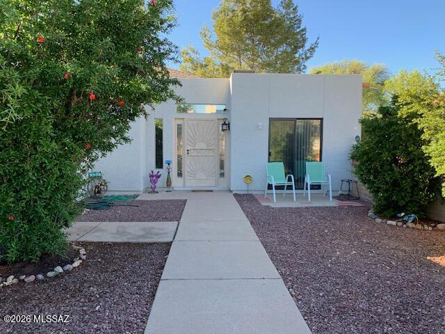 Discover this turnkey townhome in a lovely, gated community. The inviting great room, complete with a cozy fireplace, opens to a private patio featuring low-maintenance artificial turf and lush fruit trees, perfect for relaxing evenings. This home boasts a split-bedroom layout, a walk-in closet, an ensuite primary bathroom, and a convenient laundry room. Enjoy the benefits of a new roof, newer AC, and beautiful ceramic flooring. Conveniently located near schools, supermarkets, and restaurants, and just moments away from the scenic San Cayetano Mountains, this home is a must-see!