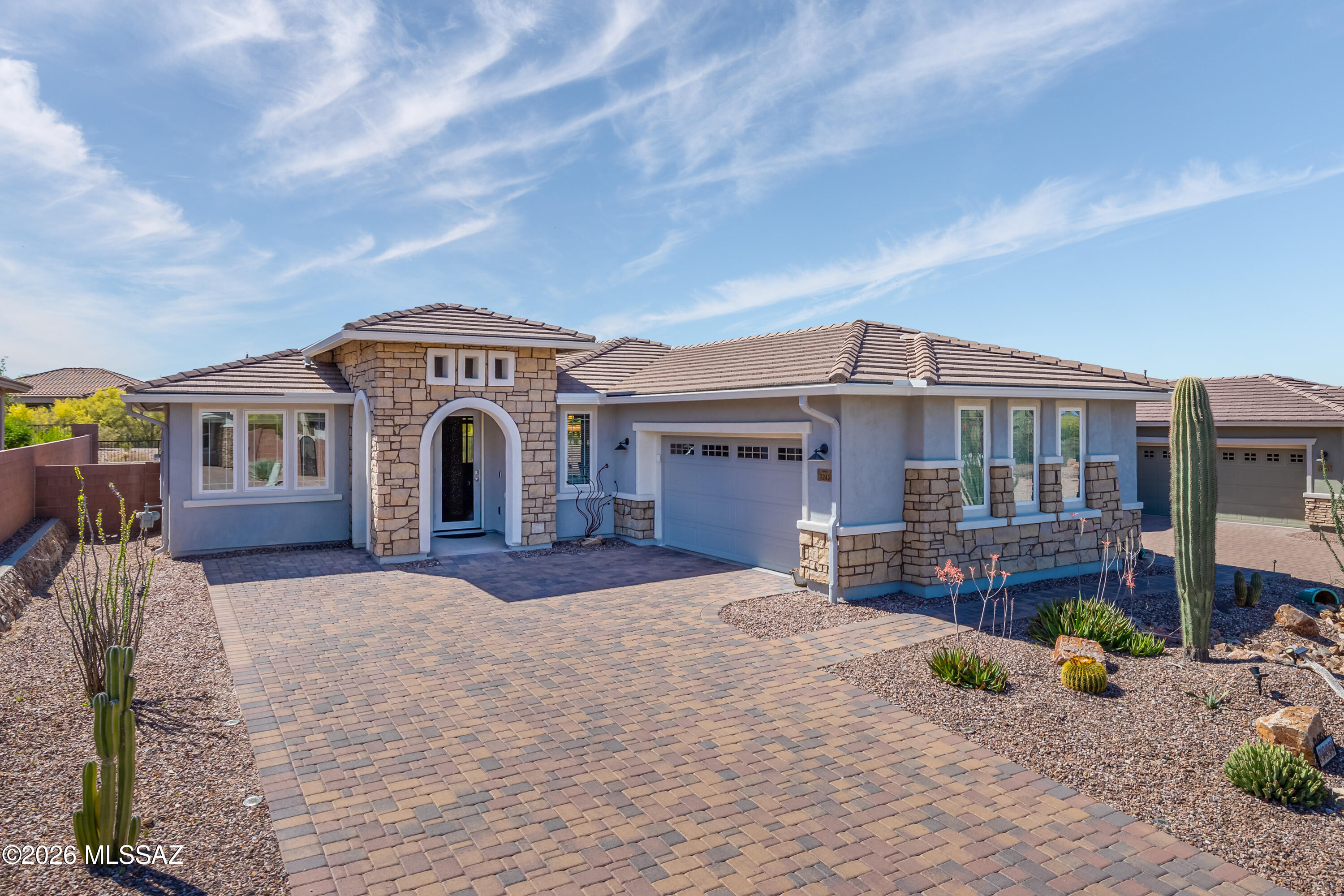 Welcome to effortless desert living in the desirable Golden Barrel at Dove Mountain community. This beautifully appointed Lookout floor plan by Mattamy Homes--one of the builder's most popular designs--offers the perfect blend of comfort, style, and functionality.
This 2 bedroom, 2 bath + den/office home showcases a thoughtfully designed layout with tile flooring throughout and soft carpet in the bedrooms for added comfort. The flexible den/office space is ideal for working from home, hobbies, or accommodating guests.
The spacious primary suite is a true retreat, featuring dual walk-in closets and a luxurious bathroom complete with an oversized walk-in shower offering both a rain shower head and a standard shower head for a spa-like experience. The kitchen is designed to impress, featuring a large island ideal for gathering, gas appliances, a walk-in pantry, rich espresso-stained cabinetry, and LED under-cabinet lighting that adds both ambiance and functionality.
Step outside to an entertainer's dream backyard, complete with paver patio and low-maintenance turf, all perfectly positioned to capture gorgeous mountain views--an ideal setting for relaxing or hosting under the Arizona sky.
Offered fully furnished, this home is truly move-in ready, making it perfect as a full-time residence, seasonal getaway, or investment opportunity.
Enjoy the beauty and tranquility of Dove Mountain living with easy access to nearby amenities, scenic surroundings, and outdoor recreation. This is a rare opportunity to own a turn-key home in one of the area's most sought-after communities.