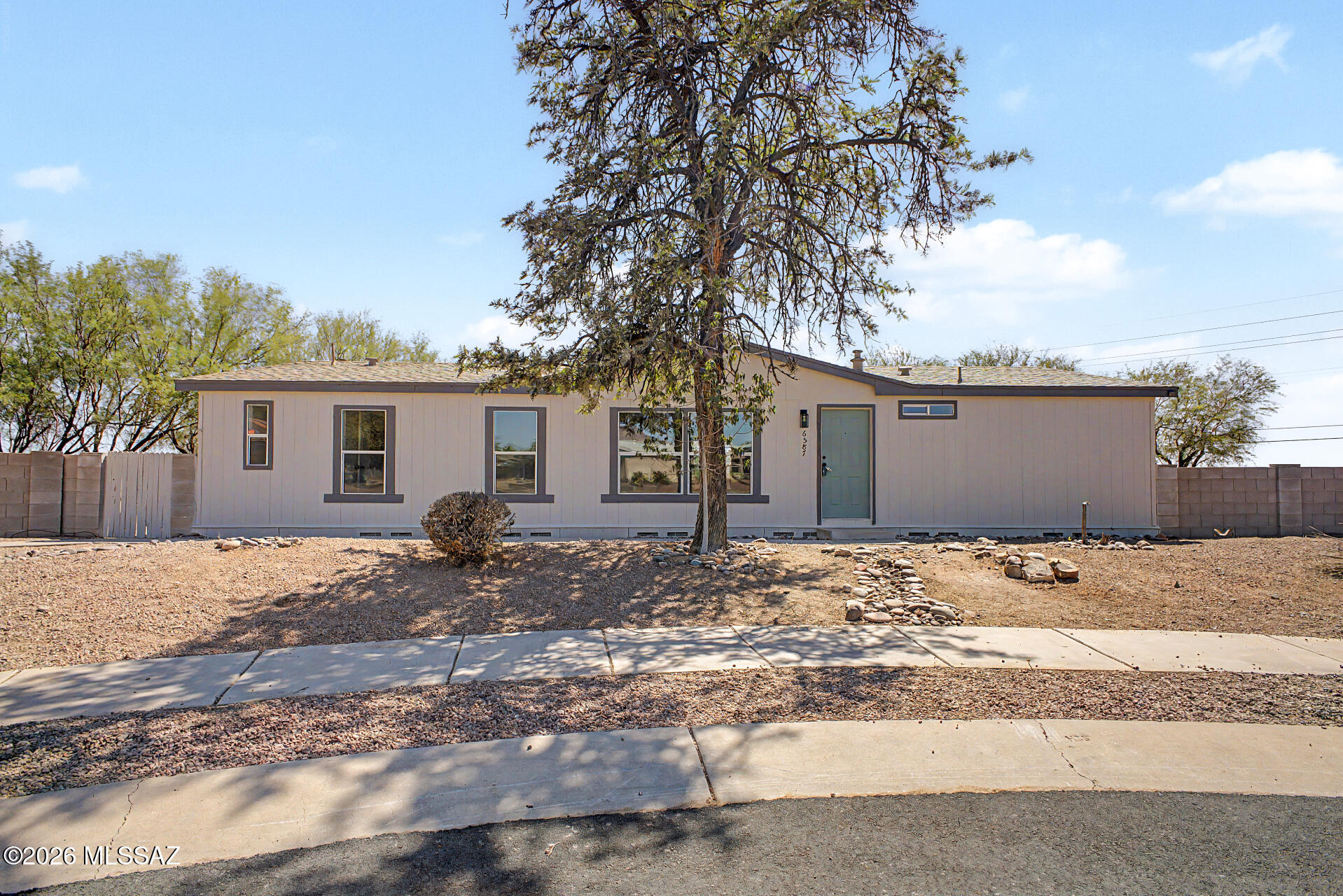Now Available! Updated manufactured home with detached 1-car garage and refreshed landscaping. Features include a new shingle roof, serviced HVAC, fresh two-tone exterior paint, new LVP flooring, new carpet in bedrooms, and updated matte black hardware throughout. Kitchen offers new cabinets, laminate countertops, and stainless steel appliances. Hall bath and primary bath have been updated with new vanities, lighting, and plumbing fixtures. Spacious primary suite includes a walk-in closet, walk-in shower, and garden tub. Laundry room with gas dryer hookup. Move-in ready!