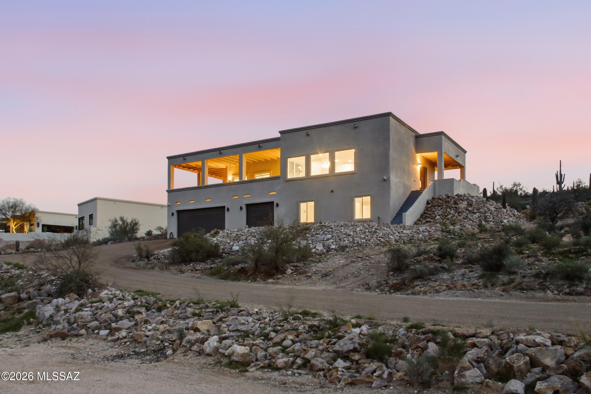 Mountain views at their finest! This stunning hillside home, completed less than two years ago, offers breathtaking mountain and city views from a spectacular wraparound upstairs deck. Thoughtfully wired for technology throughout, it blends modern convenience with luxury design. The chef's kitchen features premium Bosch appliances, an oversized pantry, and abundant storage, while huge closets provide space for everything. Large picture windows perfectly frame the scenery, bringing the outdoors in. Enjoy the peace of your private setting with a new private well and new septic. You're going to love this incredible retreat!