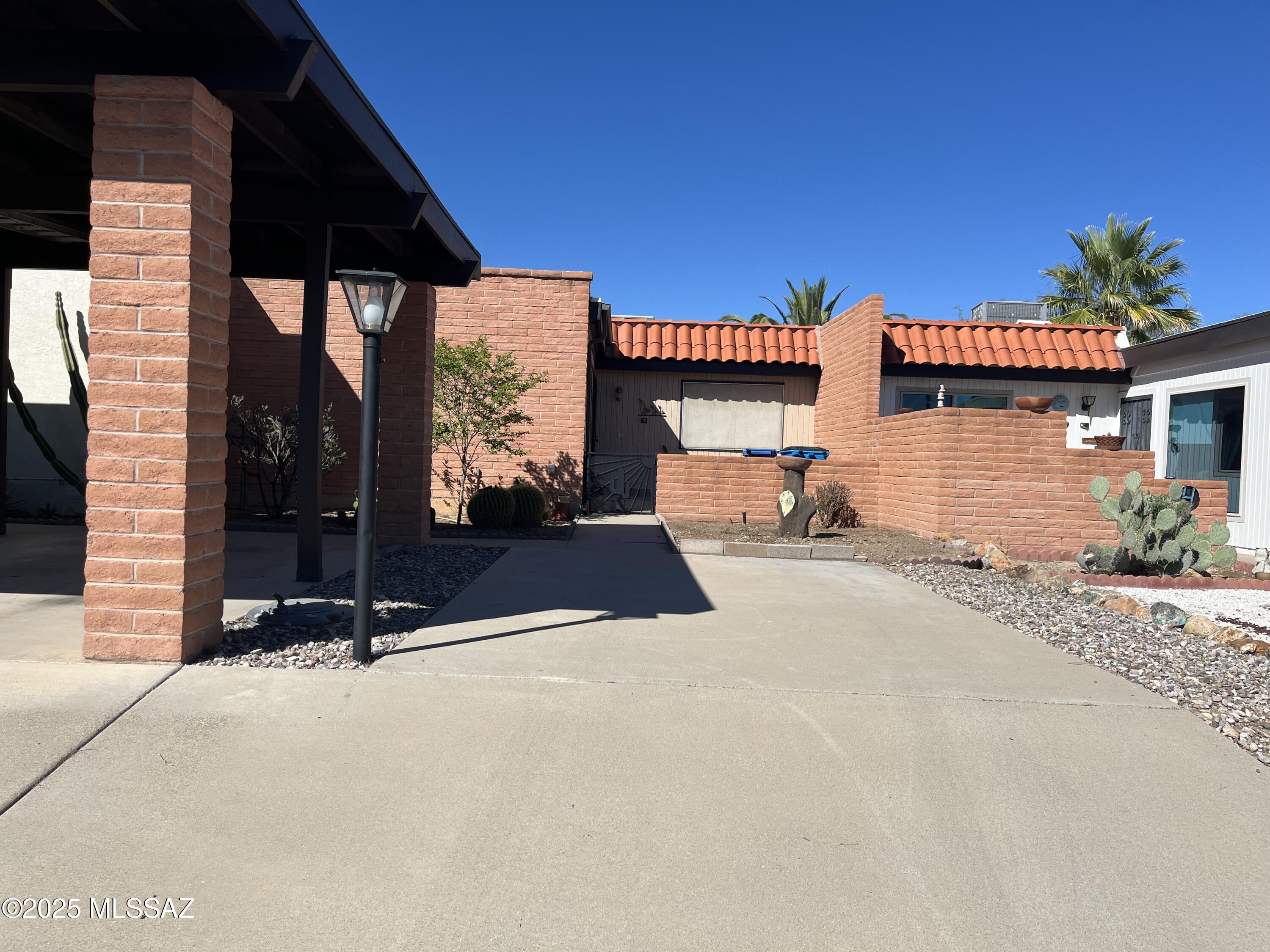 Quiet, comfortable, clean townhome in the highly desirable Casa Paloma 1 subdivision.  Centrally located close to shopping, pool, community center, golf, tennis, pickle ball, walking trails.  Perfect place to enjoy the Green Valley weather. Two carports. Arizona room for hobbies, office, den.  Surprising amount of cabinets & storage. Updated bathrooms and kitchen. Mountain view from front, natural bird sanctuary to the back. Live the life you've always wanted. Priced to sell at only $195,000.  Don't miss out on this charming desert jewel.