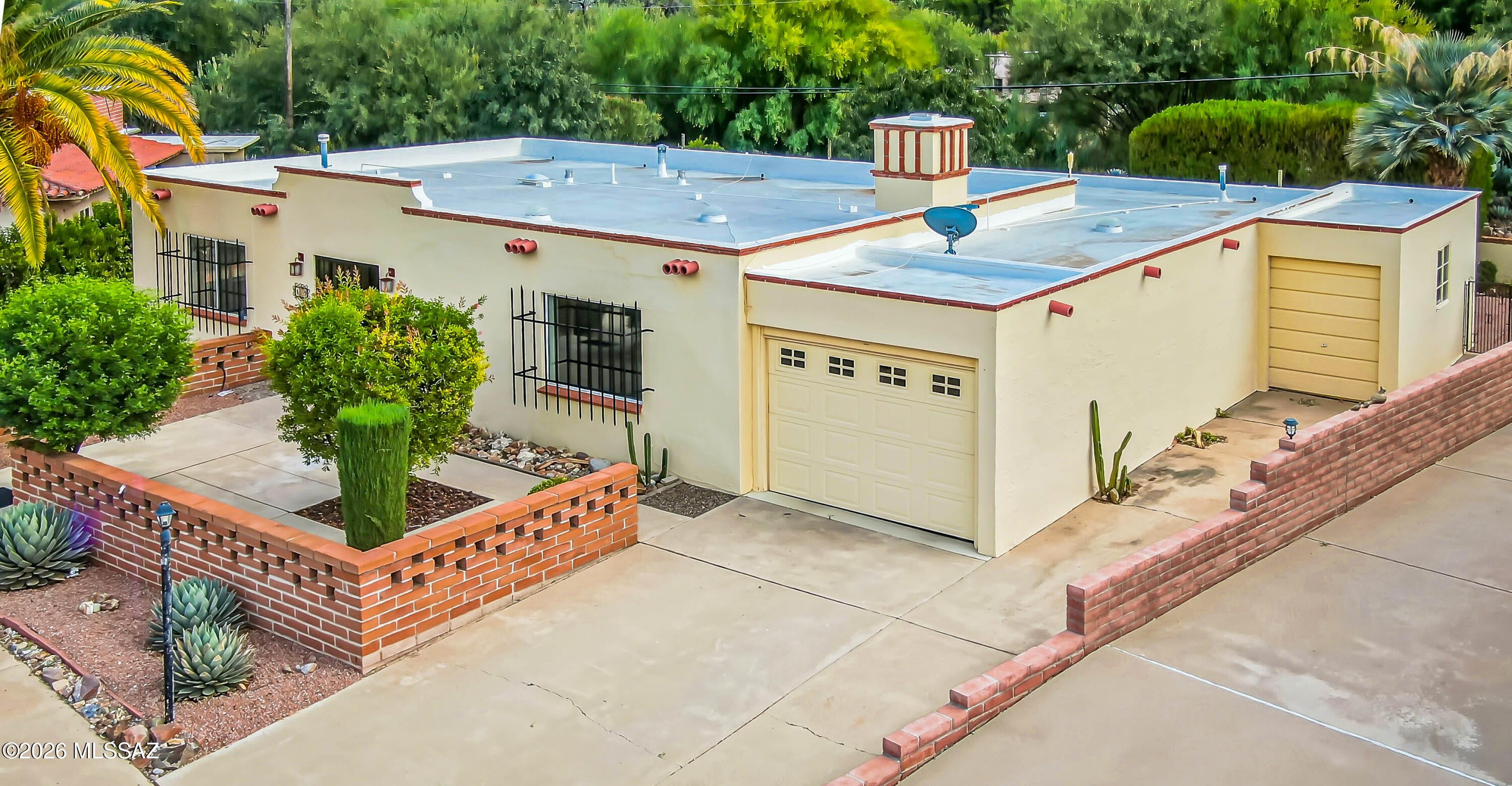 Superb location! Enjoy privacy and peaceful views from this well maintained home that backs to natural desert. Situated on an oversized lot in a large cul-de-sac, features include a front courtyard with a view of the golf course, large living room, great room with a corner brick fireplace and a fully finished Arizona room, providing plenty of space for relaxing and entertaining. Quiet, serene backyard with mature shade trees and no houses directly behind. So nice! Utility room with washer & dryer, sink, folding space and workshop area.  1 car garage plus a separate golf cart garage with space for storage or workshop. Close to shopping, golf, I-19 access and GVR center. A wonderful opportunity to enjoy Arizona living in an ideal location!