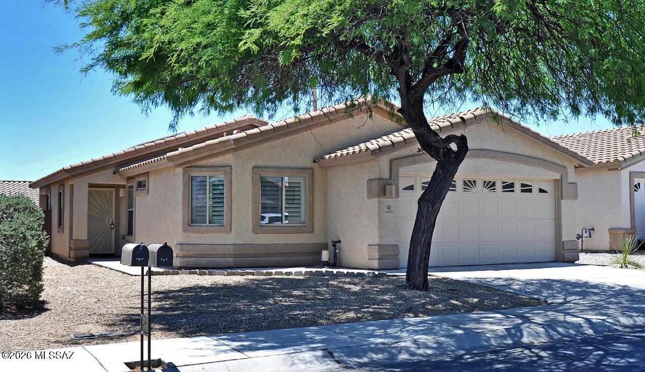 4 bedroom in premium Dove Mountain with solar! Open great rm plan with all tile flooring - no carpet! New fresh paint. Refrig,washer,dryer included.  Shutters throughout,granite in the kitchen,split bedrooms with master bedroom away from guest bedrooms. 4th bedroom has a double door entry off the great room with a closet - could be used as a bedroom or den/office. Primary bedroom has large walk-in closet. 2 car garage with storage cabinets. Private backyard with covered patio. Included solar system helps for lower electric bills. Enjoy all that Dove Mountain has to offer including walking paths & neighborhood park located nearby. 1 yr minimum lease. Non-smoking home. $45 application fee per adult. Subject to credit approval. Renters insurance required.