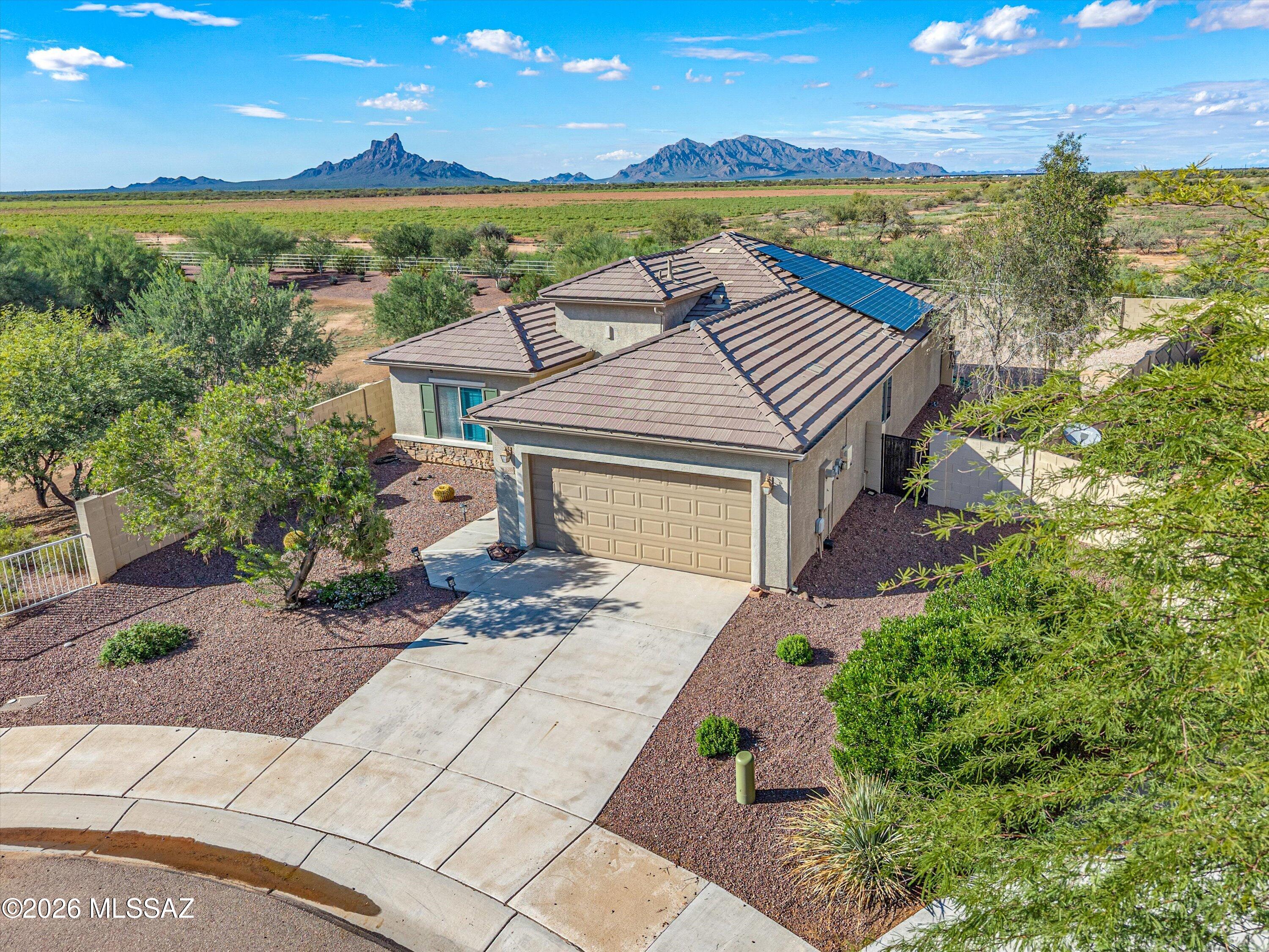 Mountain views, huge lot - better than new!! Lovely 3-bedroom, 2-bath home - Interior freshly painted! Has desirable split floor plan, spacious kitchen offering a large island, nice walk in pantry, and ample cabinetry, Perfect for everyday living and entertaining.  Soak in the scenery under the expansive covered patio, pre-wired for ceiling fans/lighting  Soak in the sun in the low-maintenance backyard w/attractive desert landscaping, and plenty of room to add a pool. Easy access to I-10, this home offers a quick commute to Casa Grande, Phoenix, and Tucson, making it ideal for commuters, full-time residents, snowbirds, or an investment property - HOA amenities include pool, water slides, basketball and volleyball courts, ball fields, full skate park, trails/playground-USDA loan Eligible
