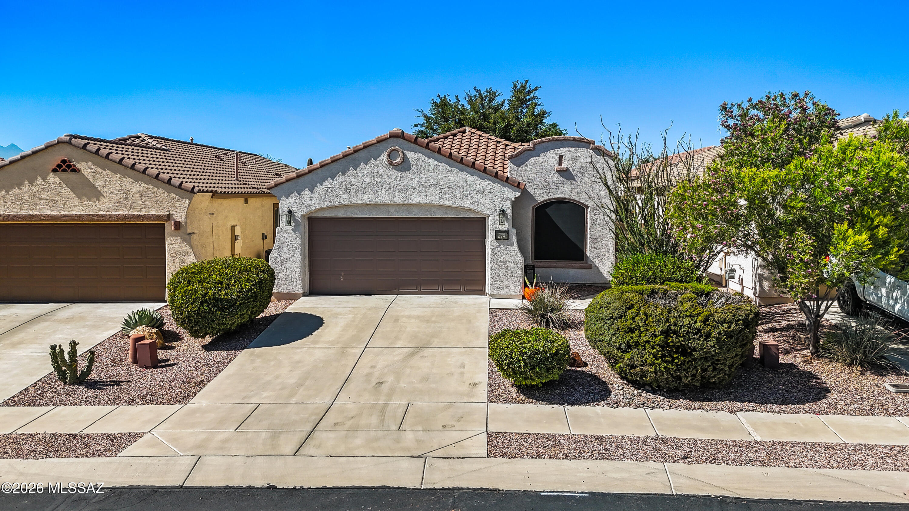 Located within Rancho Sahuarita master-planned community, Del Webb Sonora is a vibrant 55+ neighborhood with exceptional lifestyle activities. Sonora Residents enjoy a private rec center with many clubs, fitness room, heated pool, pickleball courts to support an active and engaging lifestyle. With 2BR plus a den; the well designed split-bedroom layout provides privacy for owners and guests alike. The flexible den is ideal as a home office, hobby room, art studio, or quiet reading retreat. An efficient kitchen flows seamlessly into the main living areas for effortless everyday living and entertaining. Step outside to discover a shaded desert oasis where mature landscaping creates the perfect setting for morning coffee, outdoor dining, or relaxing evenings under Arizona's beautiful skies.