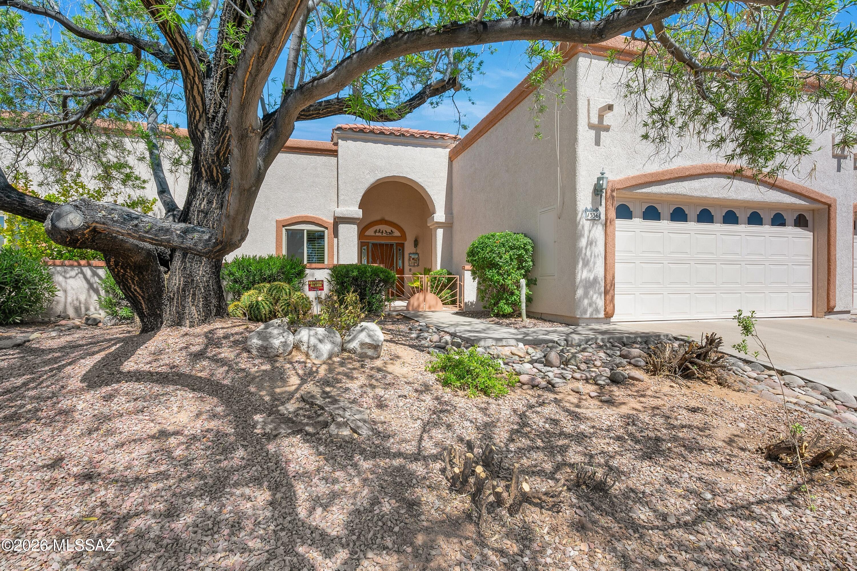 Welcome to refined desert living in the highly sought-after community of Oro Valley, where comfort, convenience, and lifestyle come together in this beautifully maintained townhome nestled within the gated enclave of Canada Vista in prestigious Canada Hills. From the moment you arrive, you'll appreciate the pride of ownership evident throughout this immaculately cared-for residence. Ideally positioned near the intersection of Lambert Lane and La Cañada Drive, this home offers exceptional walkability to everyday essentials including dining, grocery stores, medical facilities, and more--providing a lifestyle of ease and accessibility in one of Northwest Tucson's most desirable locations.
Step inside to discover a light-filled interior enhanced by soaring vaulted ceilings and an abundance o natural light streaming through multiple skylights, creating a bright, open, and uplifting atmosphere. The thoughtfully designed floor plan offers seamless flow between living spaces, ideal for both everyday living and entertaining. At the heart of the home, the inviting living area is anchored by a cozy gas fireplace, perfectly positioned just off the kitchen to create a warm and welcoming ambiance. The kitchen itself is both functional and stylish, offering ample cabinetry, a dedicated dining area, and additional bar seating--perfect for casual meals or gathering with guests. The spacious primary suite serves as a private retreat, featuring generous closet space, dual vanities, a relaxing soaking tub, and a separate walk-in shower--providing both comfort and convenience. Throughout the home, custom plantation shutters add a touch of elegance while enhancing privacy and energy efficiency. Step outside to your covered patio, where you'll find a peaceful, shaded setting ideal for enjoying Arizona's stunning sunsets and tranquil evenings. Whether you're sipping your morning coffee or unwinding after a long day, this outdoor space offers the perfect extension of indoor living. Additional highlights include the inclusion of all major appliances--refrigerator, washer, and dryer--making this home truly move-in ready. Whether you're searching for a full-time residence, a seasonal retreat, or a low-maintenance investment property, this townhome presents an exceptional opportunity. Aggressively priced to reflect both its current value and future potential, it offers the perfect canvas for personal touches while already delivering comfort, quality, and location. Opportunities like this in the heart of Oro Valley are rare--schedule your private showing today and experience firsthand the lifestyle this remarkable home has to offer.