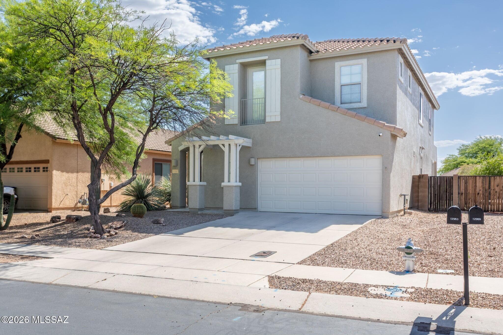 Move-in Ready in Rancho Vistoso Nearly 2,400 sq ft, flexible living spaces, & thoughtful upgrades throughout. Downstairs povides an open-kitchen features granite countertops, stainless steel appliances, cabinet pullouts, + an oversized walk-in pantry that flows seamlessly into the main living area for easy entertaining complete w/ new wood floors. Functional floorplan continues upstairs,w/ a loft space ideal for multiuse space: home office, reading area, media, workout, playspace & more. The spacious primary retreat offers his/her closets and a generously sized bath complete w/ soaking tub and shower. Backyard is ready for year round use / turf + pavers. Conveniently located minutes from Leman & Innovation Academy, OV Marketplace & easy I-10 access.