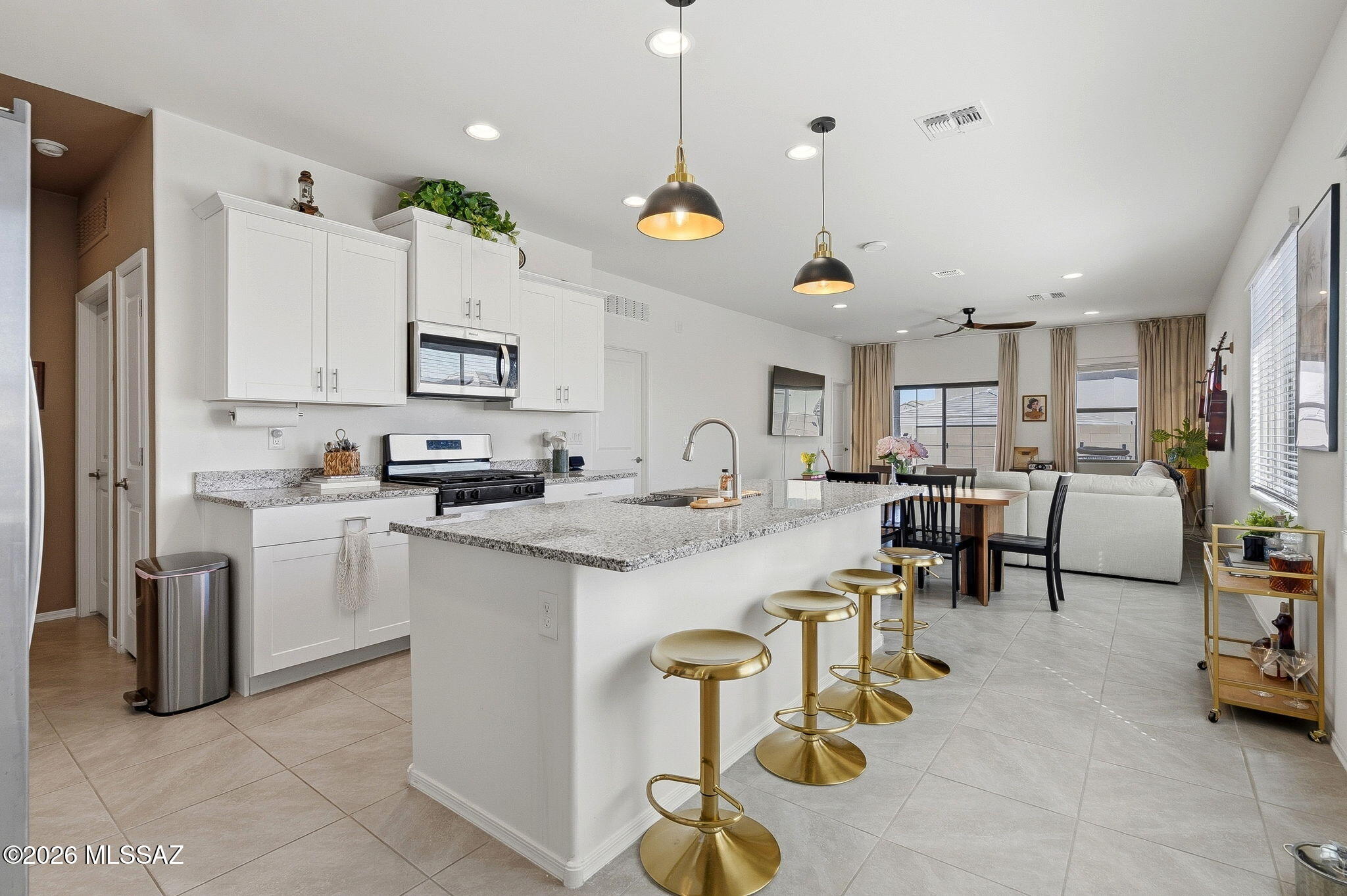 Move into a new home and enjoy the tasteful design choices that these owners have made! This beautiful 3-bedroom, 2-bath home with over 1,600 sq ft offers a functional layout and a generous north-facing backyard ideal for outdoor living. With this home, you'll have one of the best lots in the neighborhood!  Located in the growing Las Patrias community, homeowners enjoy nearby walking trails, bike paths, and neighborhood playgrounds. Just minutes from I-10, the location provides easy access to downtown Tucson, shopping, dining, and employment centers. Built with innovative energy-efficient features, this home is designed to support comfort, savings, and a healthier living environment.