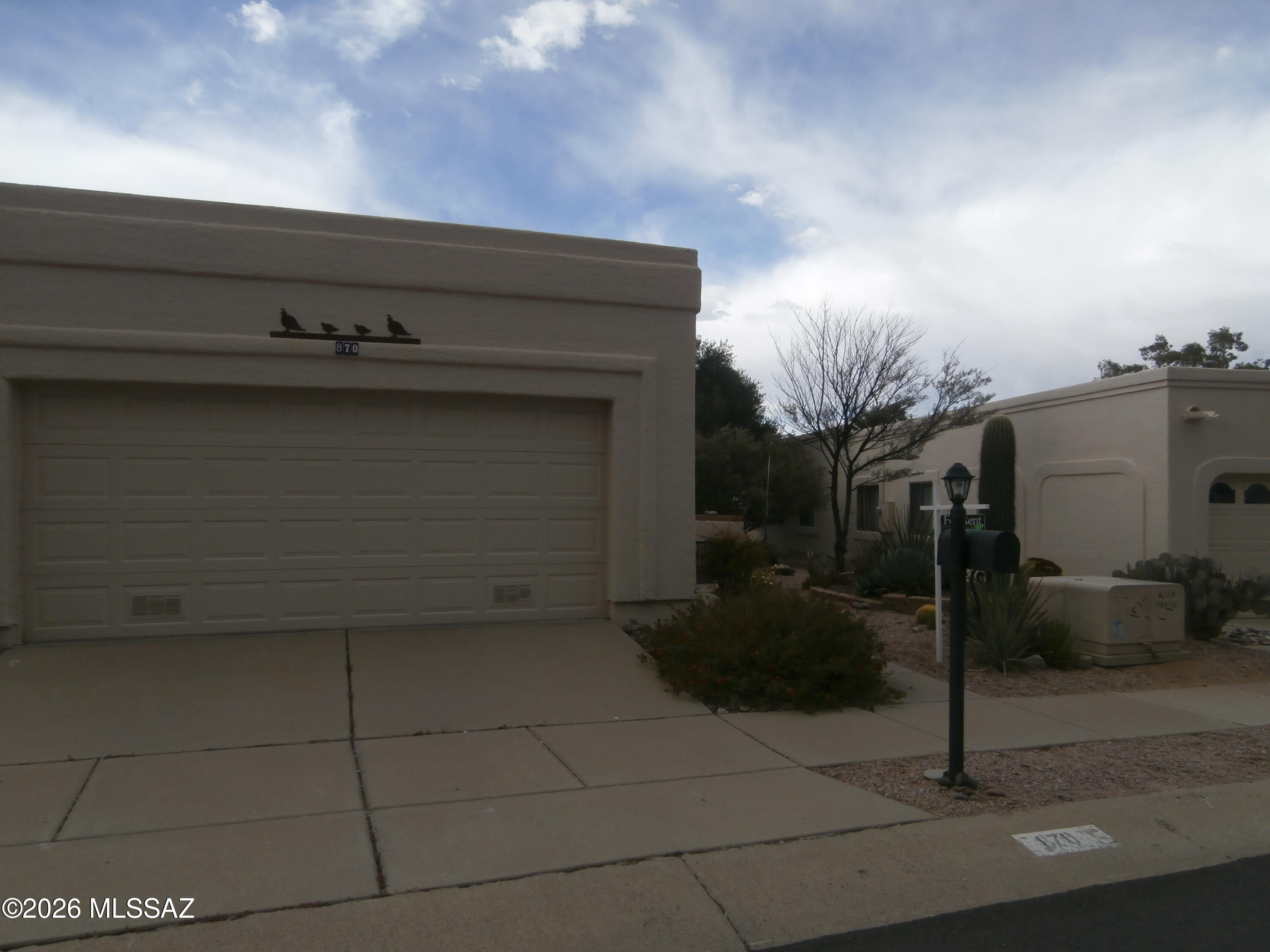 870 W Calle de Emilia  Madera Vista.
Built 1994 SQ FT 1384.
This is a lovely 2 Bedroom, 1.75 baths, 2 car garage Townhome.  Nice court yard in front, security door on front door and a pretty glass panel door on the front.  Nice Foyer  which has door going to garage and french doors going to 2nd bedroom.  Open floor plan living room and kitchen with bar that separate the two rooms.
Kitchen is a gallery kitchen with fridge, electric range, microwave, dishwasher, desposal and lots cabinets. Off kitchen is the laundry room with washer and dryer and shelves for storage. Large master bedroom with on suite with dual sinks and shower. Hall bath has tub and shower combo. Nice enclosed back Patiowith some lovely plants very private nothing behind you but desert.