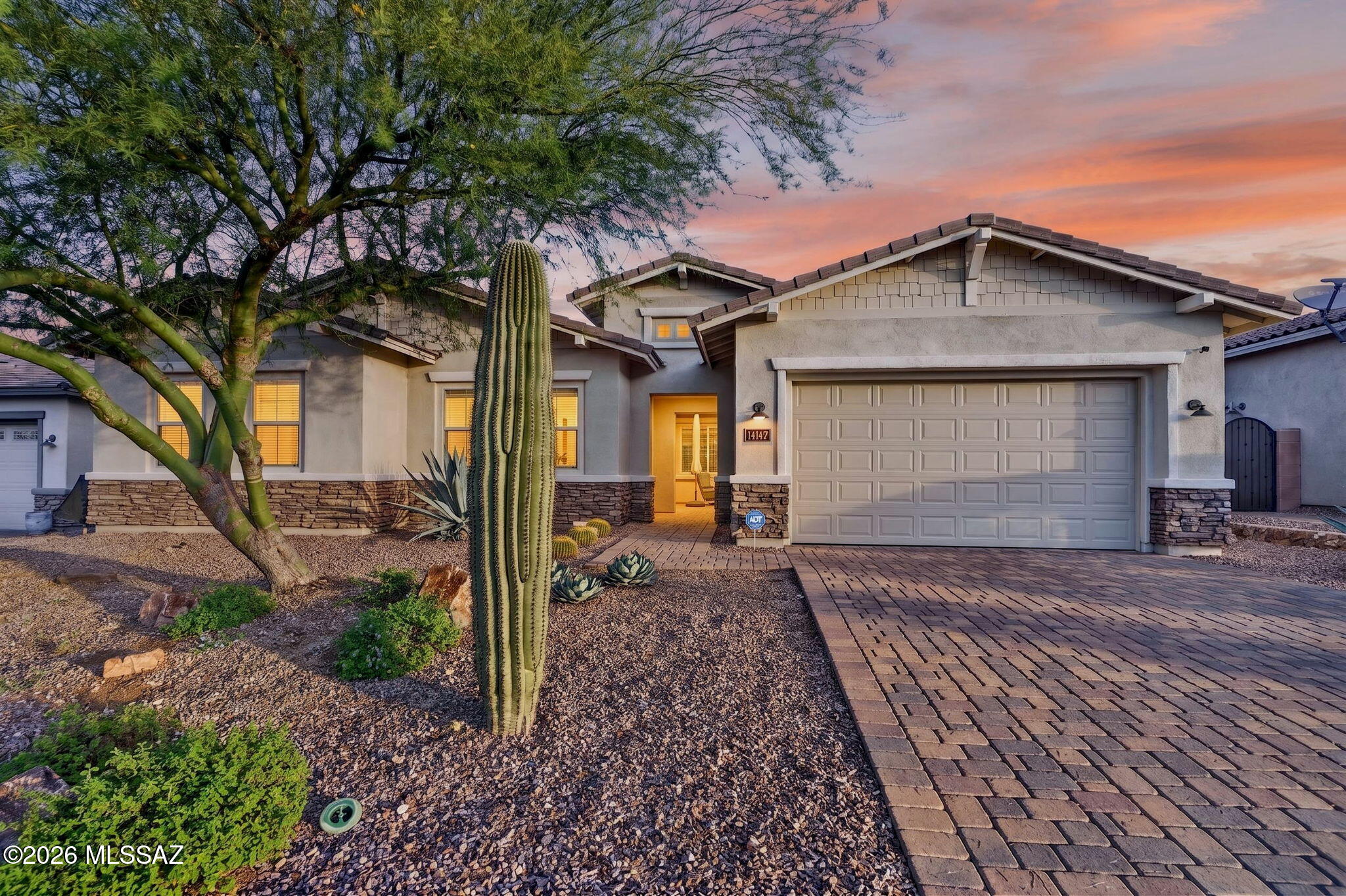 Voted #1 on the Tucson Association of REALTORS® Home Tour! METICULOUSLY maintained and move-in ready, this Craftsman-style Tortolita floor plan blends open-concept living with thoughtfully defined spaces. A secured courtyard entrance welcomes you into a gracious foyer with soaring ceilings and a seamless flow to the main living areas. The spacious kitchen features granite countertops, stainless steel appliances, gas cooktop, oversized island/bar, walk-in pantry and convenient wet bar. Designed for a variety of lifestyles, the flexible bonus retreat is ideal for an office, media room, guests or hobbies, with an upgraded sliding door opening directly to the cozy courtyard. The privately situated primary suite features a California Closets upgrade, walk-in shower with spa niche and dual vanities. Thoughtful upgrades continue throughout, including:premium wool carpeting, an upgraded walk-in shower in the secondary bath, mud/drop room, two-tone paint, recessed lighting, water softener and remote-controlled wall-mounted courtyard patio heaters. Even the garage has been upgraded with a mini-split HVAC system, epoxy flooring, Gladiator organization system and insulated garage door. A termite warranty is also included for added peace of mind, and the sellers have maintained monthly pest control service. The serene backyard is beautifully landscaped with desert plantings and rolling hill views, providing a peaceful setting to enjoy Arizona's spectacular sunsets. Move right in and enjoy the home and the Dove Mountain lifestyle!

DOVE MOUNTAIN COMMUNITY:
Nestled in the prestigious, master-planned foothills of the Tortolita Mountains, this property offers the ultimate resort-style lifestyle. Enjoy low-density, luxury desert living with direct access to over 50 miles of pristine hiking, biking, and equestrian trails connecting to the 2,400-acre Tortolita Preserve. Golf enthusiasts will love the proximity to 81 holes of championship golf across three private clubs, plus the world-class amenities of the neighboring 5-Star Ritz-Carlton Resort and Spa. Everyday conveniences are just minutes away, including the modern Dove Mountain Centre, local craft breweries, and premium outlet shopping, all with seamless I-10 access for an easy commute. Located within the top-tier Marana Unified School District, featuring the cutting-edge Dove Mountain CSTEM K-8 School right in the community. Embrace a protected visual landscape of sweeping mountain views and iconic saguaro forests in one of Southern Arizona's most coveted destinations.