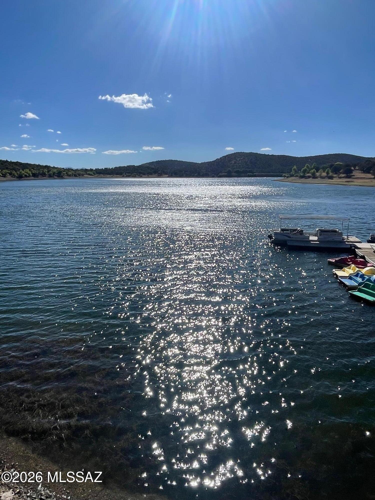 One of the larger lots in the Parker Lakeview Est.  plenty of trees, easy access off Hwy 83, build a cabin with 2nd story deck or living space for views of the lake. Approximately .6 miles to the Parker lake boat launch. Water company can be tapped into across the road or drill a well.
Lake store open 5 days a week. Live off grid. 
Deer, Quail, Turkey in the area. Great get a way location or live year round with your RV