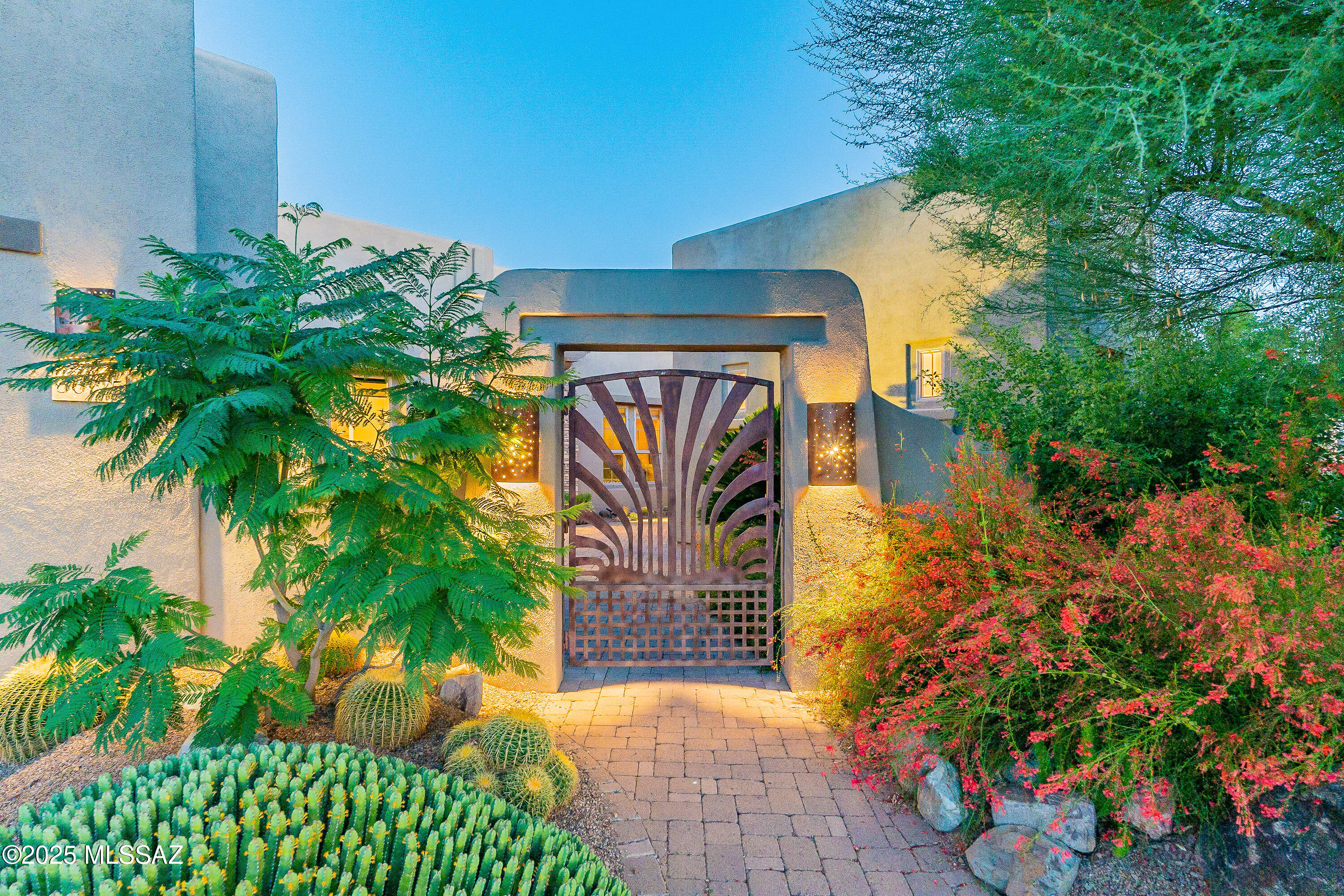 Curb appeal, luxurious designer touches & majestic mtn views above the golf course - a territorial-style gem in The Preserve at SaddleBrooke. This SABINO offers 3 bedroom suites, including casita, plus a den, w/tile flooring throughout. Private backyard oasis, features multiple outdoor living spaces, gas fireplace, jetted salt water spool w/waterfall, & fruit trees. Gated courtyard & copper sconces lead to custom mesquite wood/glass front door & matching den doors. Chef's kitchen w/large island, granite counters, Viking & Bosch appliances, solar tubes, and elegant Italian light fixture. The primary bathroom offers a retreat with split vanities, quartz counters, walk-in shower, & plumbed for a tub. With its private casita, guests enjoy their space while you relax & entertain in style.