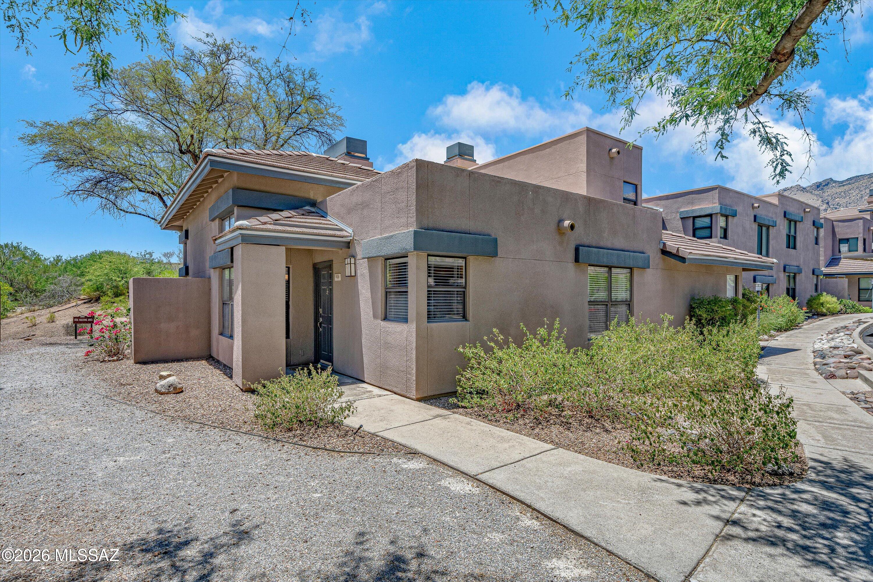 Rare opportunity in the sought-after Greens at Ventana Canyon! This rare single-story casita-style condo is one of only a few of its design in the community and offers exceptional privacy with no units above or below. Featuring 2 king-sized bedrooms, 2 full baths, and walk-in closets in both bedrooms, home boasts soaring ceilings, lots of light, open living/dining with fireplace. Upgraded kitchen includes SS appliances. New HVAC recently installed. Enjoy a covered patio backing to common area and you are just steps from the pool & BBQ. HOA covers roof maintenance/replacement, fire protection, common area landscaping. Amenities include 3 pools (2 heated), 2 spas, fitness center, clubhouse, assigned covered parking, & easy access to hiking and biking. Offered fully furnished and turnkey!