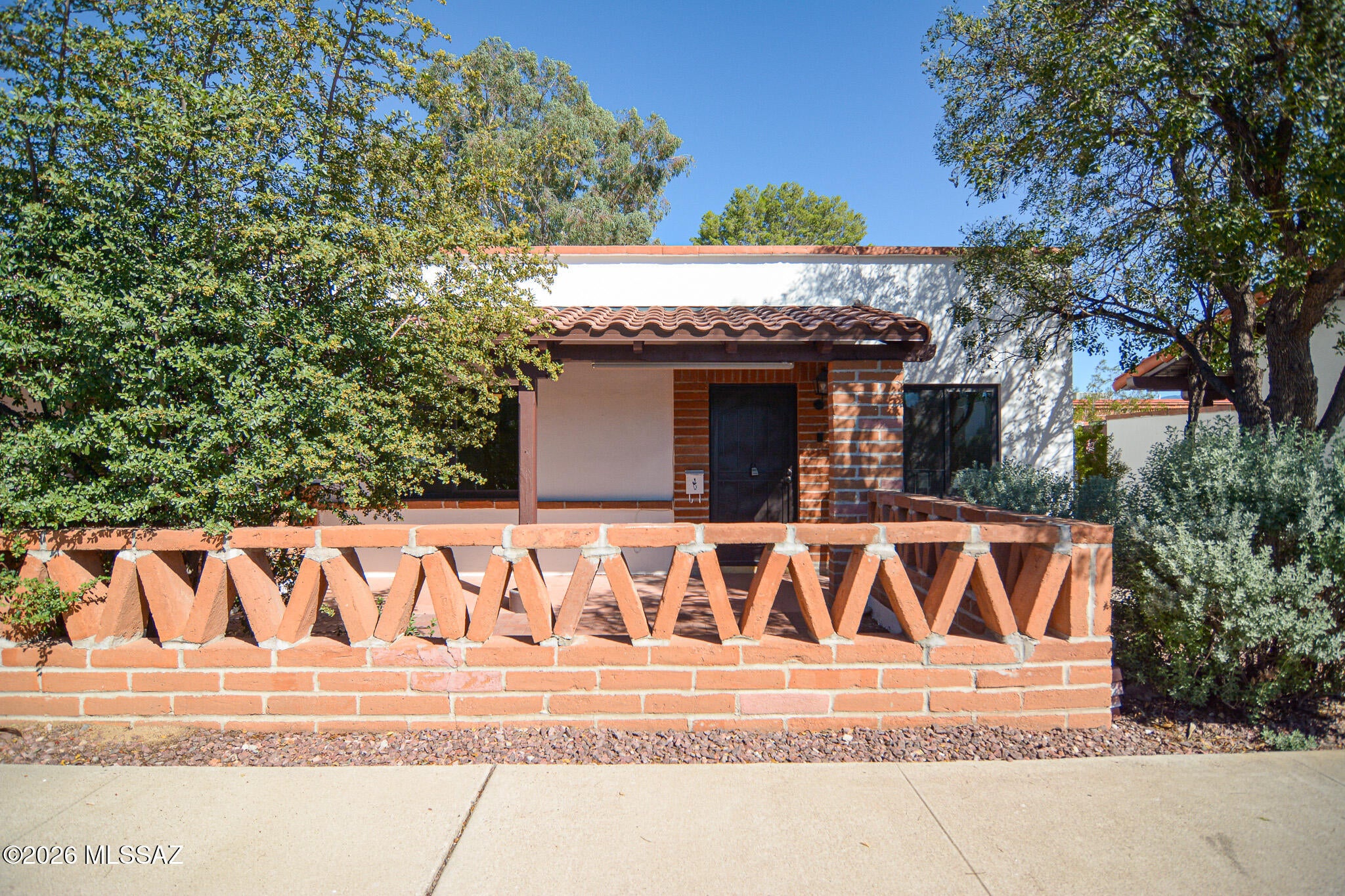 Well maintained Toenhouse in a desirable 55+ community in Green Valley. Brick construction. Rich wood laminate flooring in bedrooms and living area. Kitchen features white appliances. Dual pane windows. New door hardware. HOA includes Water, Sewer, Trash, HVAC, Pest Control, Roof/Exterior Maintenance, Water Heater, as well as a Blanket Insurance Policy. Beautiful common area landscaping. Community features sparkling pool. This home shows beautifully.