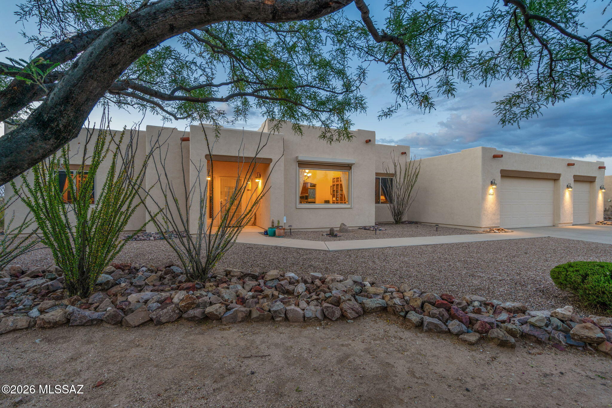 Nestled on a premium .87-acre lot & surrounded by protected natural desert, this stunning home offers the perfect blend of privacy, beauty, & AZ charm. Mature ocotillos create a truly special setting, while the mountain views add to the home's serene appeal. Inside, you'll find a spacious open floor plan w/ high ceilings & ceramic tile flooring throughout the main living areas. The kitchen offers rich maple cabinetry, granite countertops, & picturesque views of the backyard-perfect for both everyday living and entertaining. This thoughtfully designed home includes a generous primary suite w/ walk-in closet. Split bdrm floorplan. Experience outdoor living at its finest. flagstone patios, built-in BBQ, fire pit, large covered patio. All of this, just moments to Saguaro Natl Park. Owned solar