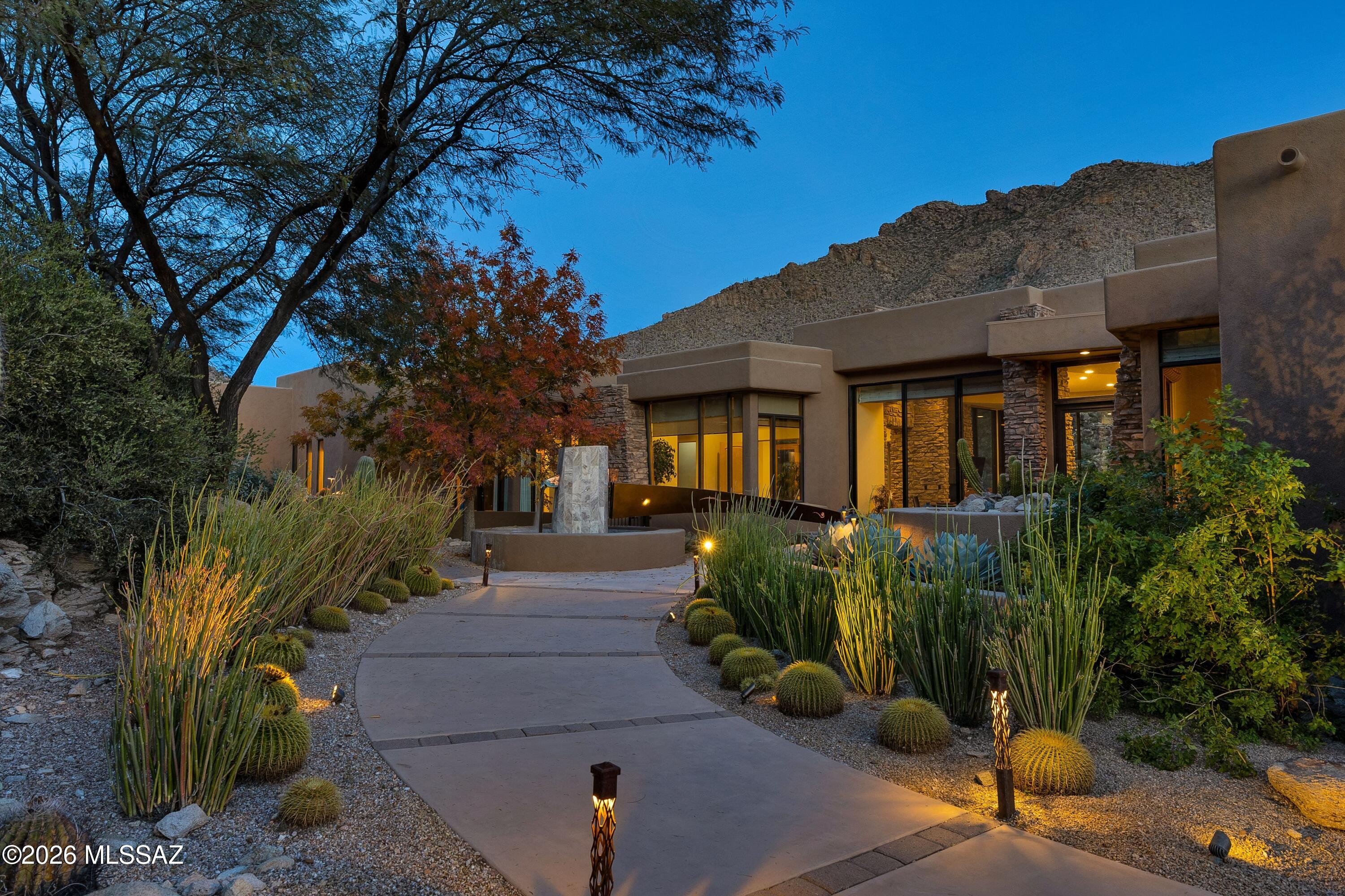 New kitchen counters & backsplash.Spectacular Soloway Designed Custom Residence in guard gated Canyon Pass at Dove Mountain. Resort and family style living at its best! Picture living in a part art gallery, part spa, part nature retreat and part resort hotel (staff not included!). This mesmerizing residence boasts an artistically stunning water feature art piece as you arrive at the front courtyard.  Enter through the custom created artistic front door into an open living area filled with wall to wall windows and glass doors. Interior views are stunning-and once you're out back the views turn to majestic. Photos can't capture the extraordinary oasis style living of this sprawling lifestyle. Fine craftsmanship throughout this luxury custom home. Each bedroom has its own private bathroom. Beautiful Dove Mountain is a 2025 Readers' Choice contender for Best Master-Planned Community. Enjoy Dove Mountain's world class golfing, outstanding hiking trails, biking paths, state of the art sports club, casual and fine dining options. Easy access to theatre and the arts, University of Arizona campus and multiple airports. Sonoran Desert living at Dove Mountain means enjoying outdoor living at its best. That lovely "cooing" sound you hear in the evenings may be the gentle Inca Doves which live in the area and give this elegant enclave its name. Pima County's 3,000-acre Tortolita Mountain Park borders Dove Mountain to the north. To the south is the 2,400-acre Tortolita Preserve, with its outstanding biking and hiking trails, designated to be permanently sustained by the City of Marana and the State of Arizona. Nestled in the beautiful Tortolita Mountain Foothills, Dove Mountain is perhaps the epitome of Southwest desert living. The temperate climate allows residents to enjoy an indoor/outdoor lifestyle virtually all year-round, not just in in the fall, winter and spring seasons for which the region is famous. The wildlife of Dove Mountain is fascinating. The Sonoran Desert is home to species like the Great Horned Owl, the Golden Eagle, the Black-chinned Hummingbird, Gambel's Quail, the Hooded Oriole and the Cactus Wren, Arizona's official bird. The lifestyle here is fascinating, mesmerizing, graceful, luxurious, peaceful and fun. Perhaps your own Dove Mountain story is just beginning at THIS lovely, fine custom home. Call for a private showing.