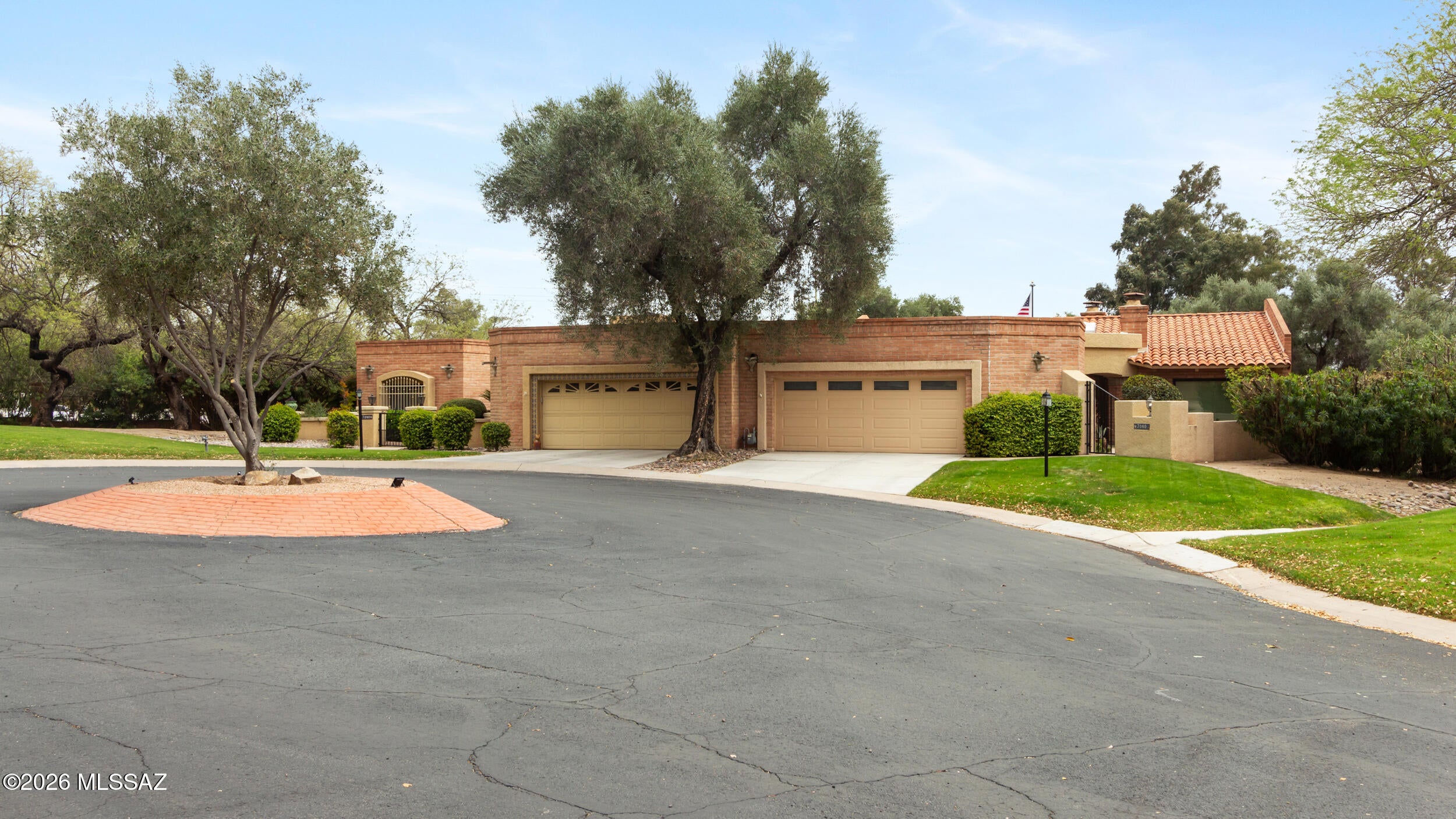 Residesigned and beautifully updated using professional interior design principals, this spacious 2-bd, 2-ba cul-de-sac residence is located in the prestigious gated Riverbend community. Thoughtful updates include modern kitchen and bathrooms, new flooring, and fresh interior paint throughout. The bright, open layout feels welcoming and functional, with 2 fireplaces, Arizona Room, and versatile bonus space ideal for a home office, creative studio, or hobby area. Enjoy resort-style community amenities including a heated pool and spa, clubhouse, pickleball and tennis courts, and a dog park. Conveniently located near shopping, dining and the River Walk and the Tucson Foothills lifestyle.